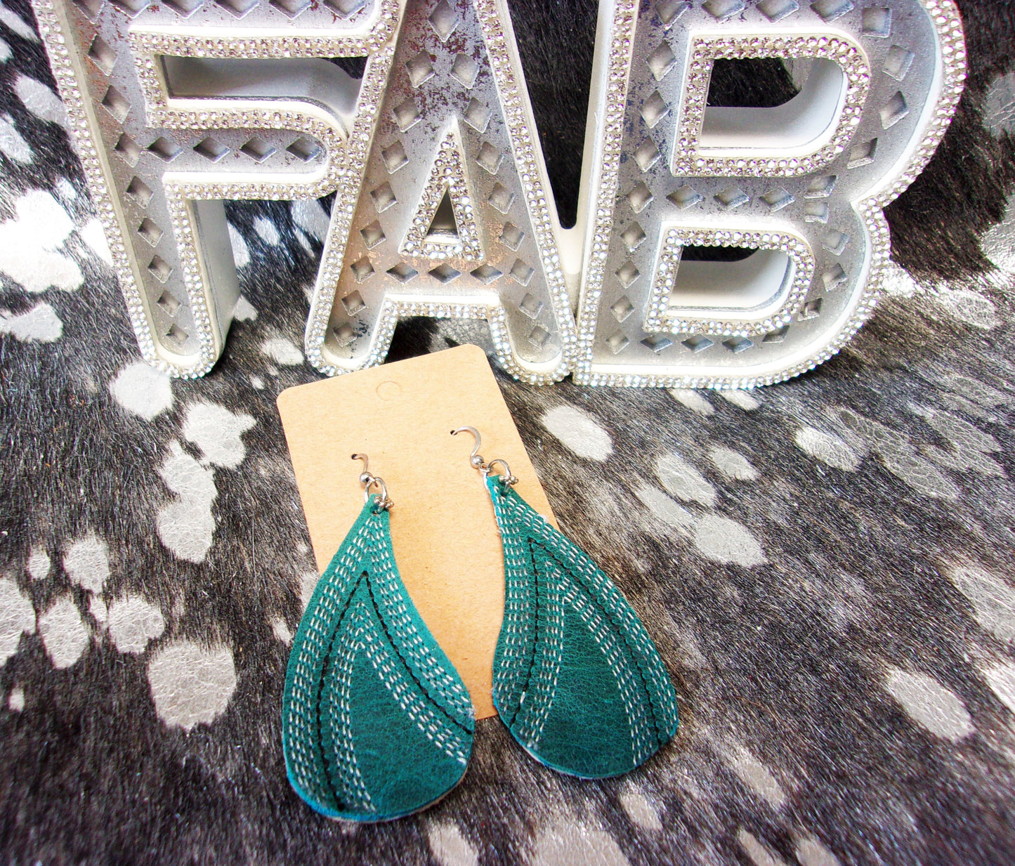 Leather Earrings ER26 handcrafted from cowboy boots. Shop jewelry at ChrisThompsonBags.com and buy the best cowboy boot scraps, cowgirl earrings, eco friendly fashion, hippie earrings, leather earrings, leather jewelry, recycled fashion, sustainable jewelry, unique earrings at Chris Thompson Bags.