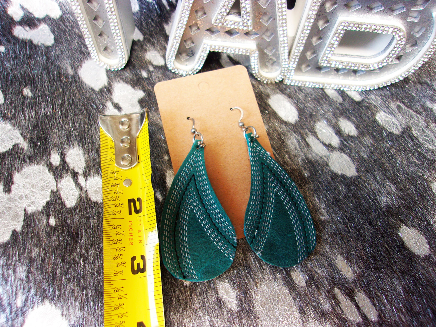 Leather Earrings ER26 handcrafted from cowboy boots. Shop jewelry at ChrisThompsonBags.com and buy the best cowboy boot scraps, cowgirl earrings, eco friendly fashion, hippie earrings, leather earrings, leather jewelry, recycled fashion, sustainable jewelry, unique earrings at Chris Thompson Bags.