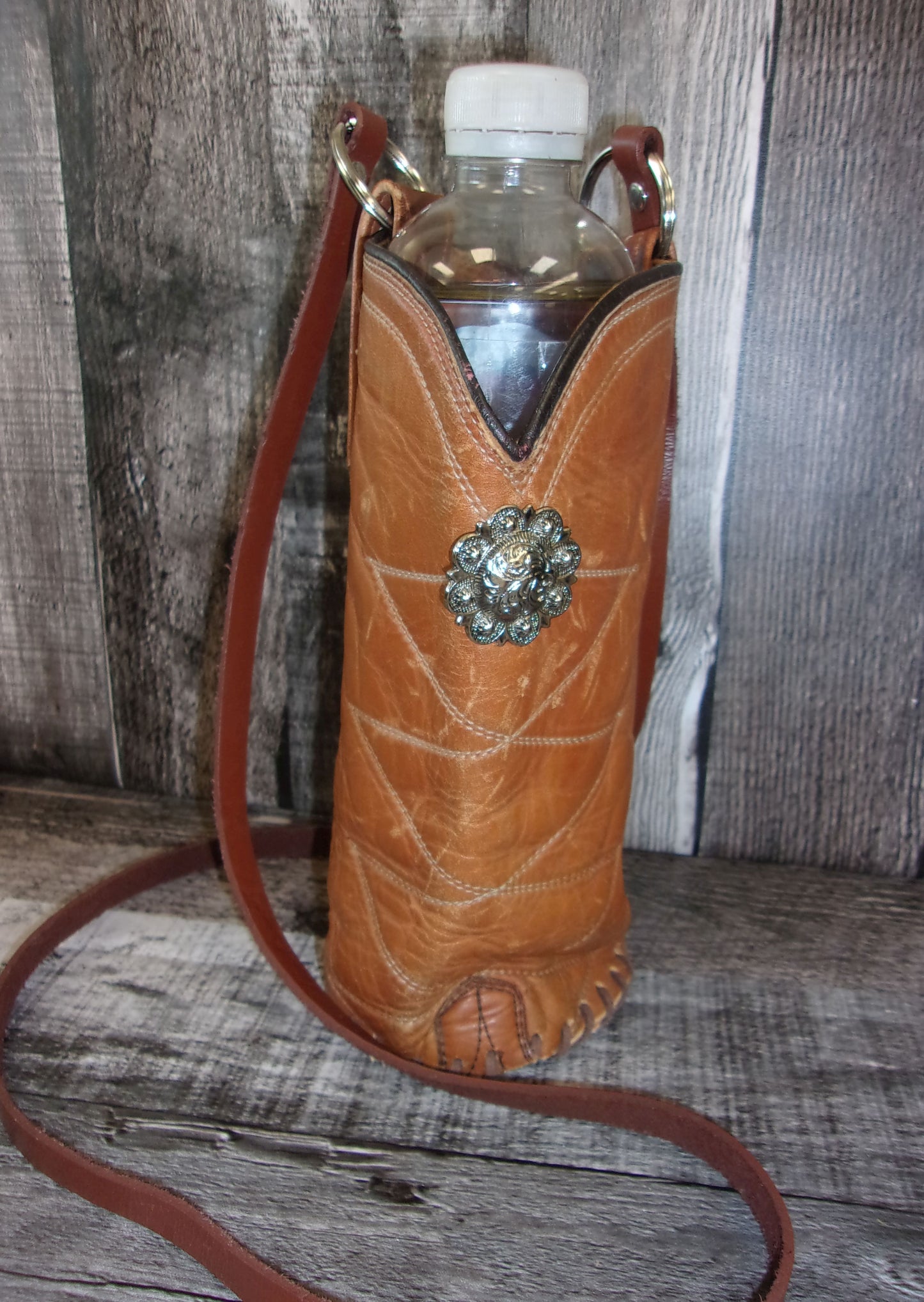 Cowboy Boot Wine Water Tote WA49 handcrafted from cowboy boots. Shop Wine Carrier Bags at ChrisThompsonBags.com and buy the best cowgirl wine tote, leather wine carrier, Leather Wine tote, recycled cowboy boots, unique gift for her, unique gift for him, water bottle caddy, water bottle holder, water bottle tote, western wine carrier, western wine tote, wine lovers gift, Wine Tote at Chris Thompson Bags.