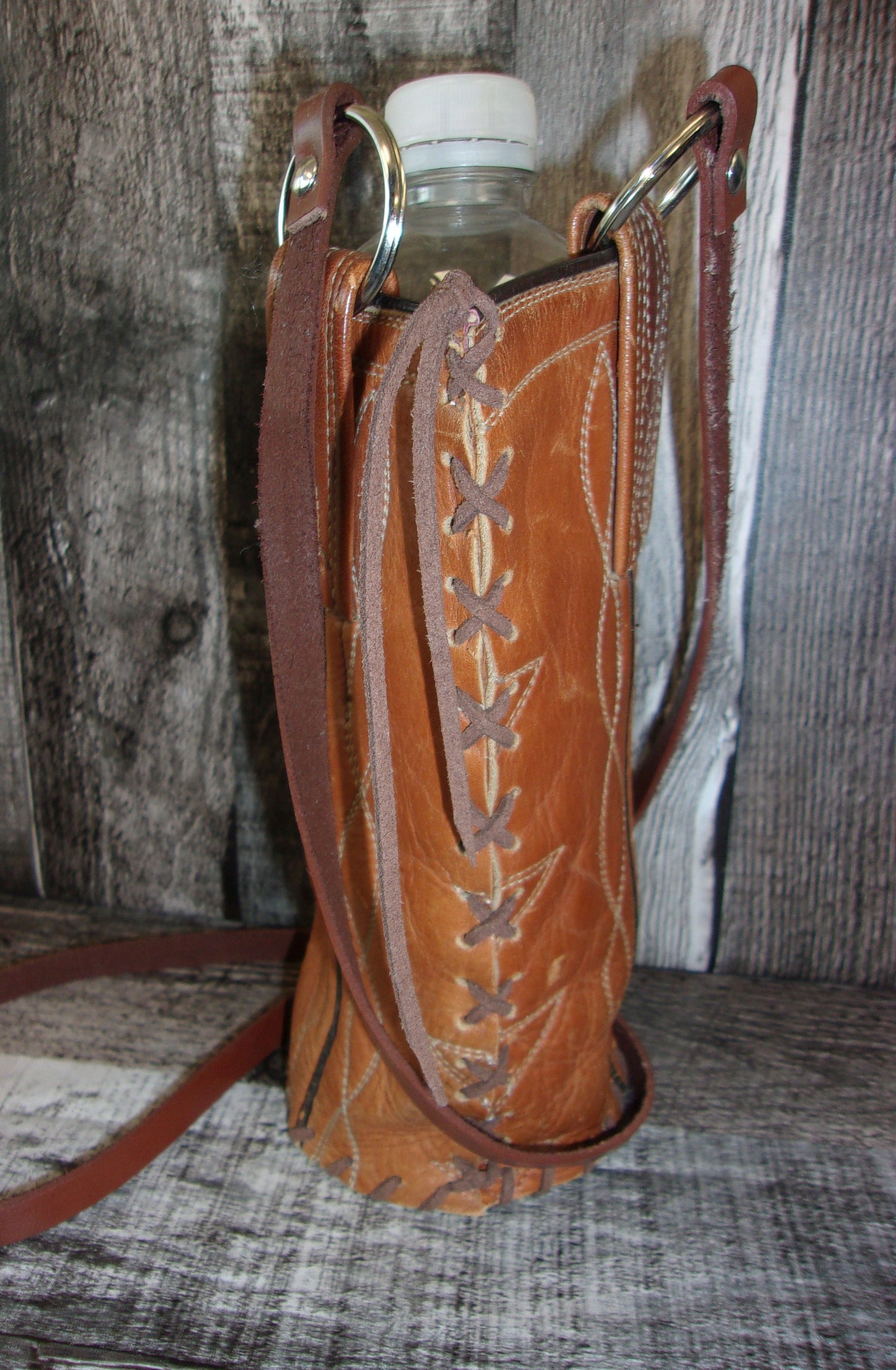 Cowboy Boot Wine Water Tote WA49 handcrafted from cowboy boots. Shop Wine Carrier Bags at ChrisThompsonBags.com and buy the best cowgirl wine tote, leather wine carrier, Leather Wine tote, recycled cowboy boots, unique gift for her, unique gift for him, water bottle caddy, water bottle holder, water bottle tote, western wine carrier, western wine tote, wine lovers gift, Wine Tote at Chris Thompson Bags.