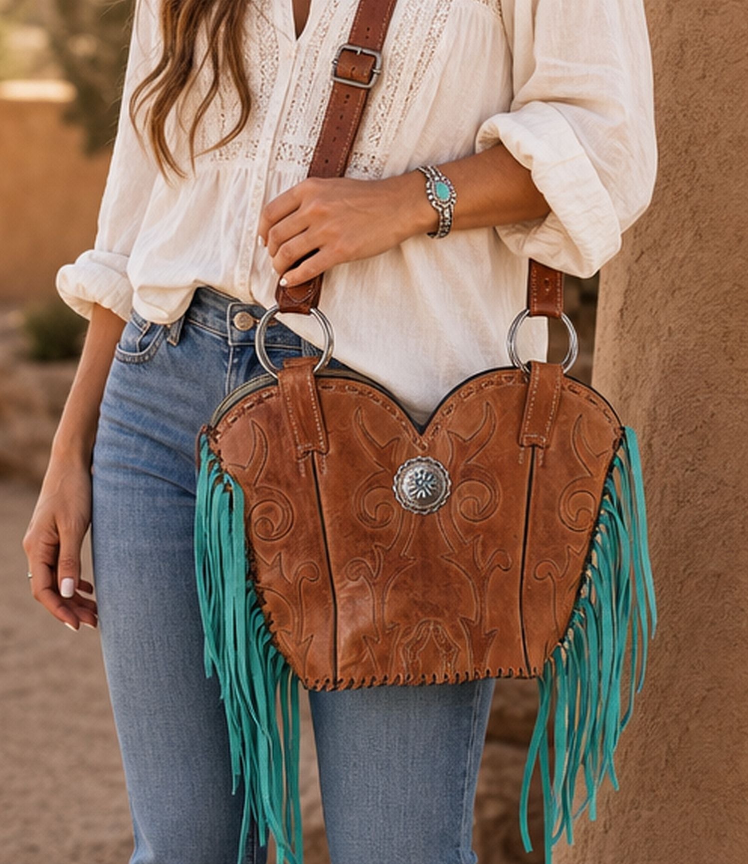 pretty leather bag with fringe on a woman's arm