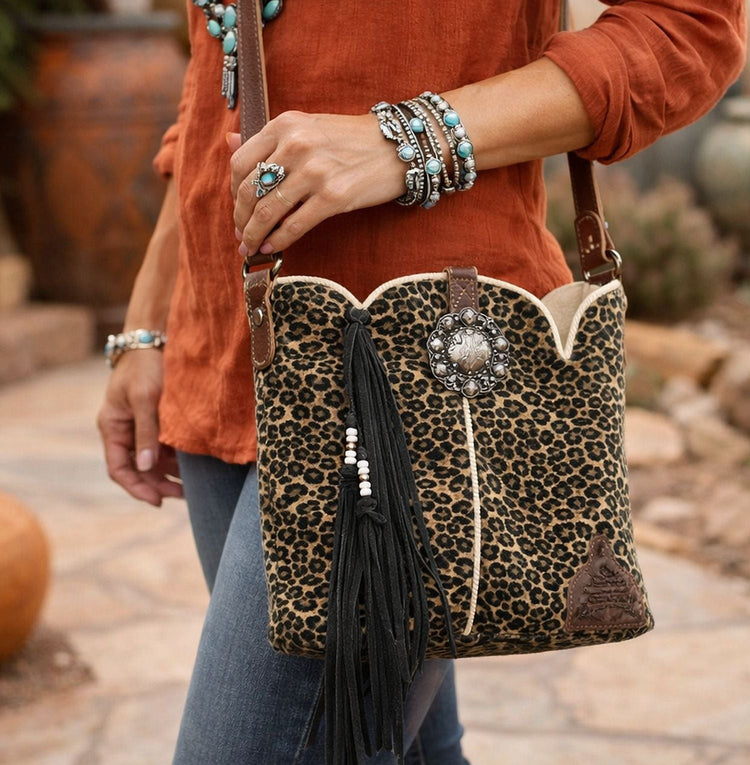 woman carrying cheetah print leather purse