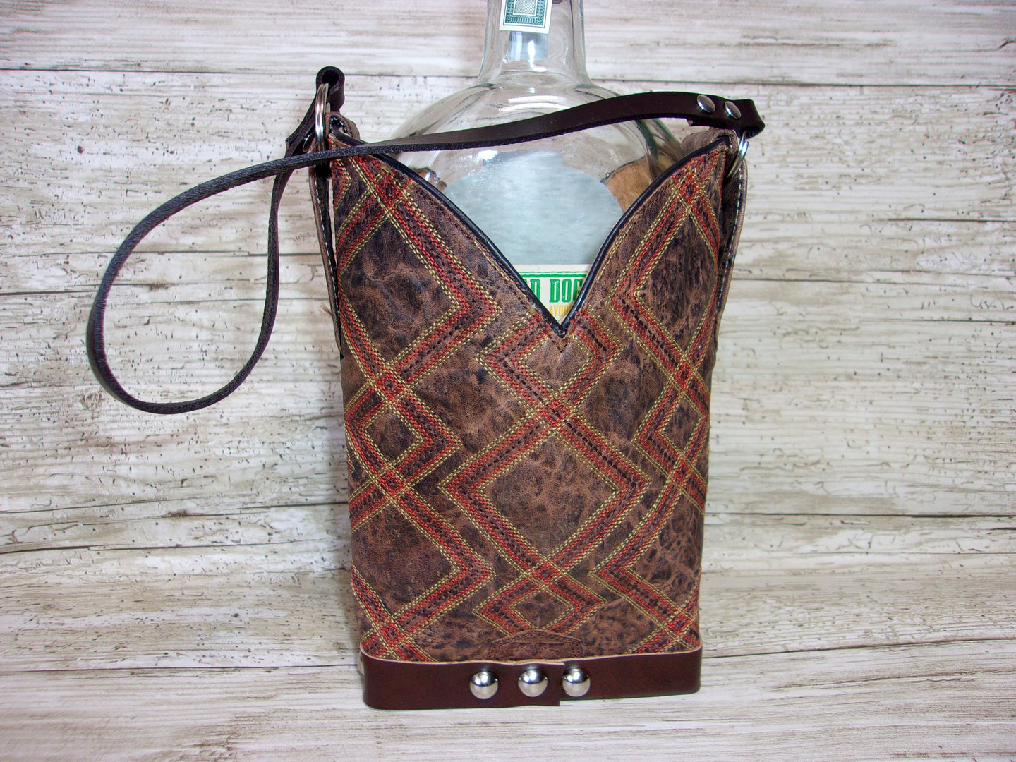 Cowboy Boot Whiskey Tote CR185 handcrafted from cowboy boots. Shop Barware at ChrisThompsonBags.com and buy the best country bridesmaid, country wedding gift, cowboy gift, cowgirl gift, cowgirl party bag, crown royal tote, groomsman gift, rodeo party, rustic liquor tote, western gift, western wedding gift, whiskey caddy, whiskey lover gift at Chris Thompson Bags.