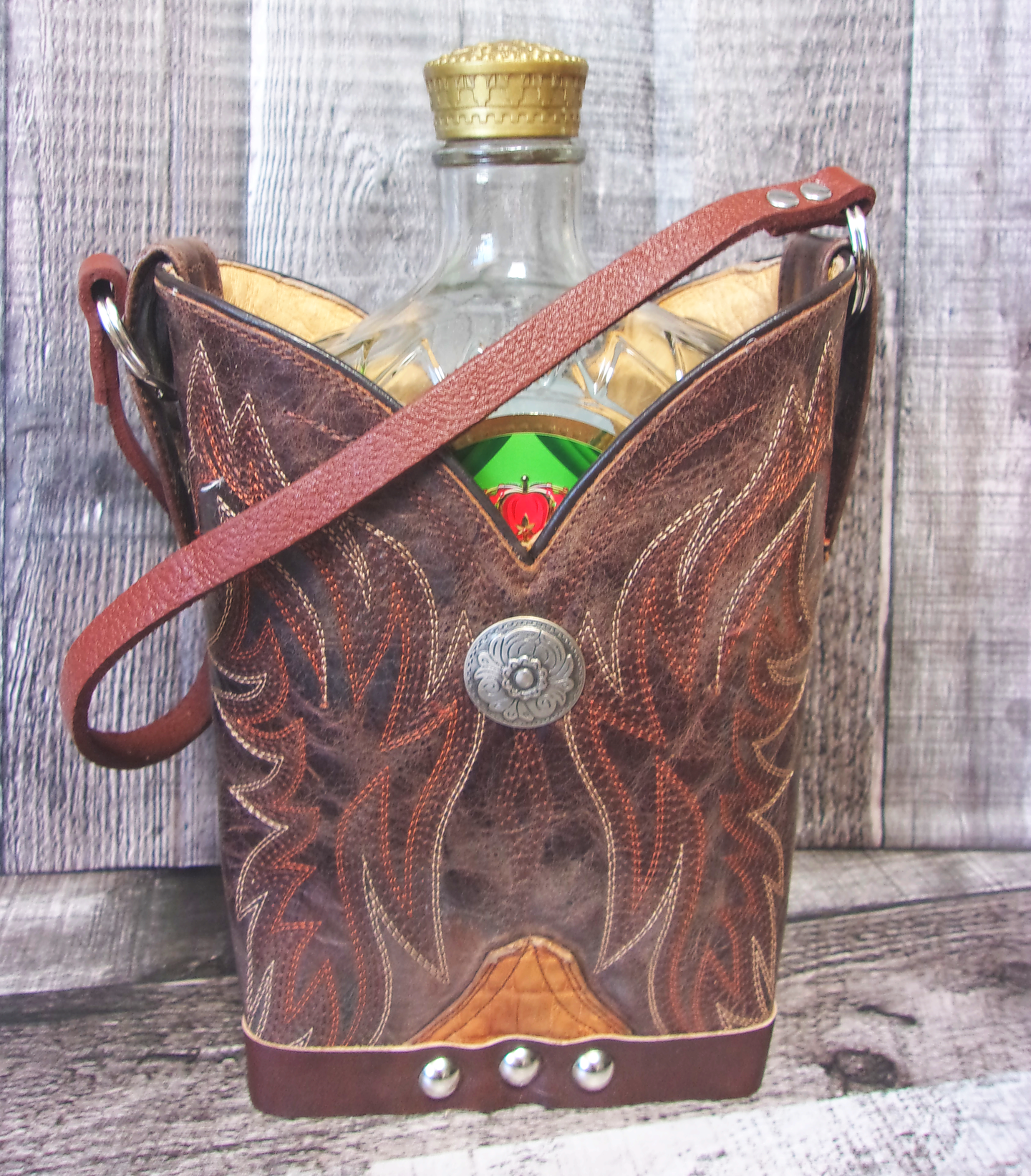 Cowboy Boot Whiskey Tote CR193 handcrafted from cowboy boots. Shop Barware at ChrisThompsonBags.com and buy the best country bridesmaid, country wedding gift, cowboy gift, cowgirl gift, cowgirl party bag, crown royal tote, groomsman gift, rodeo party, rustic liquor tote, western gift, western wedding gift, whiskey caddy, whiskey lover gift at Chris Thompson Bags.