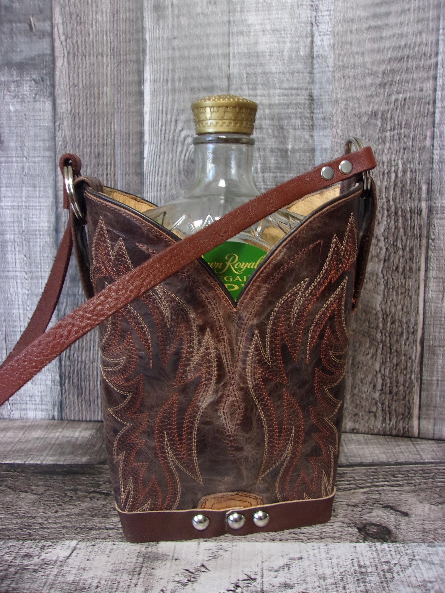 Cowboy Boot Whiskey Tote CR193 handcrafted from cowboy boots. Shop Barware at ChrisThompsonBags.com and buy the best country bridesmaid, country wedding gift, cowboy gift, cowgirl gift, cowgirl party bag, crown royal tote, groomsman gift, rodeo party, rustic liquor tote, western gift, western wedding gift, whiskey caddy, whiskey lover gift at Chris Thompson Bags.