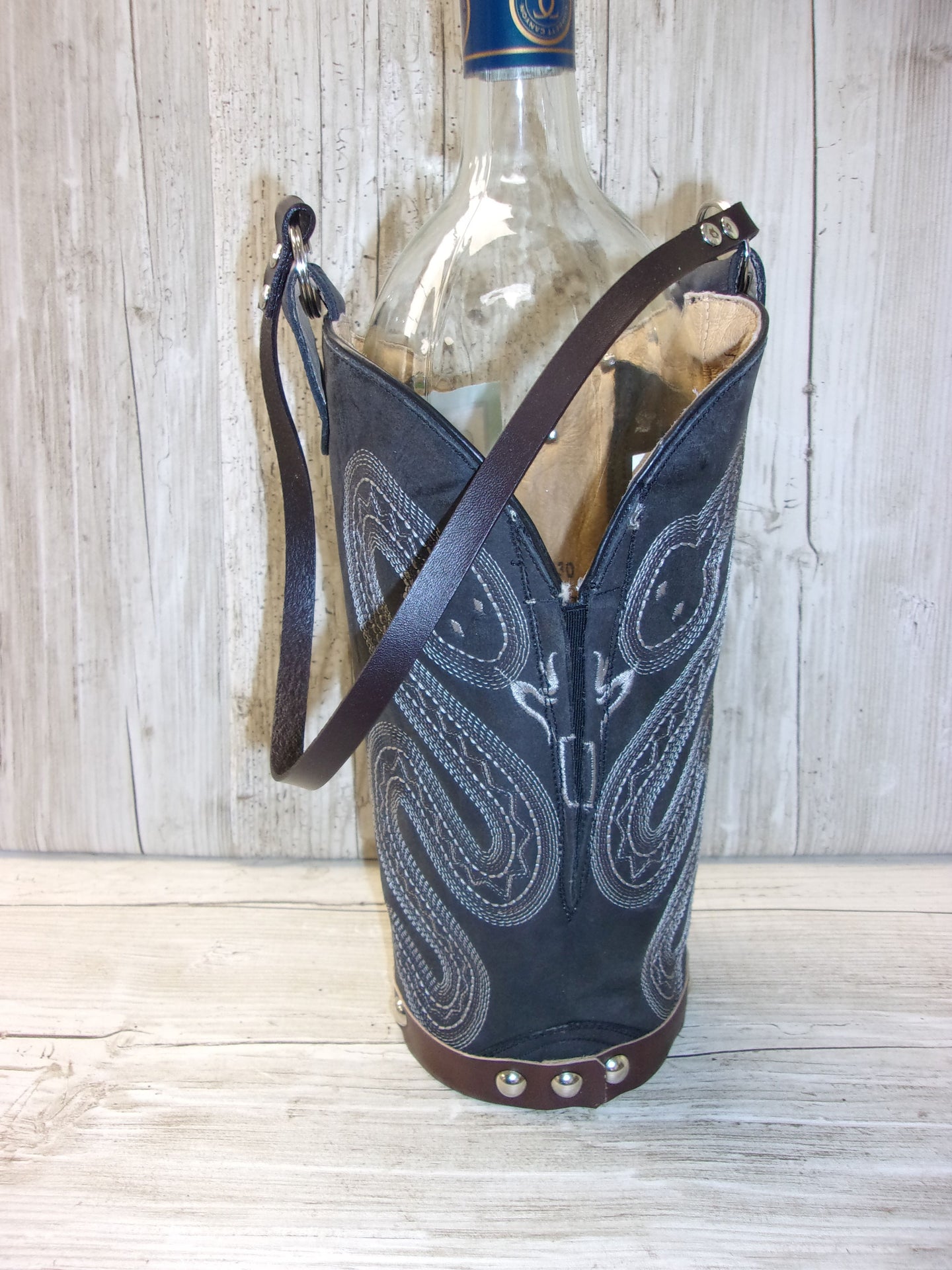 Cowboy Boot Wine Tote wt706 handcrafted from cowboy boots. Shop Wine Carrier Bags at ChrisThompsonBags.com and buy the best country bridesmaid, country centerpiece, country wedding, cowboy gift, cowgirl centerpiece, cowgirl gift, cowgirl wine bag, rodeo party bag, rustic wine carrier, unique western gift, western wine tote, wine lovers gift at Chris Thompson Bags.