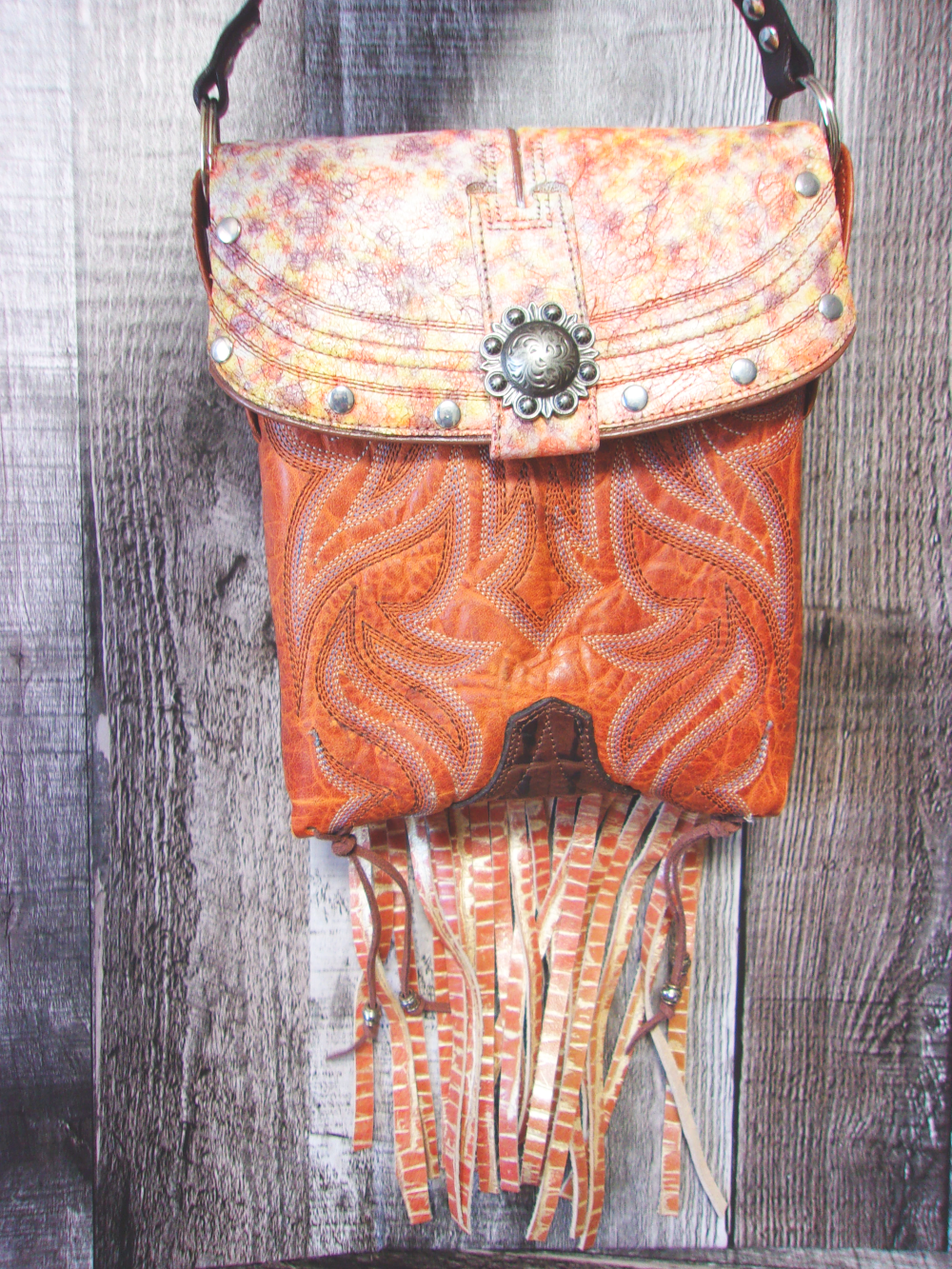 Small Cowboy Boot Purse with Fringe sm237 handcrafted from cowboy boots. Shop all unique leather western handbags, purses and totes at Chris Thompson Bags
