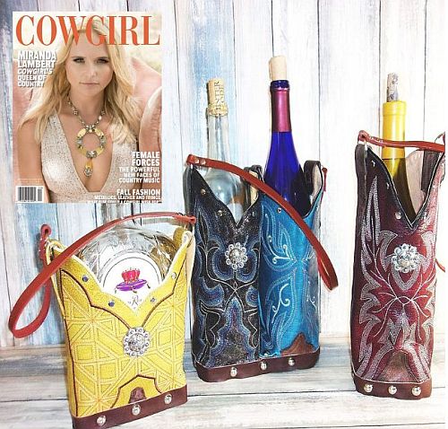 Cowgirl-themed wine bottle holders with decorative designs on a magazine cover featuring a woman.