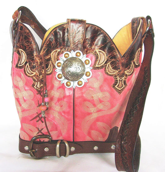 Decorative pink and brown bag with intricate designs and embellishments on a white background