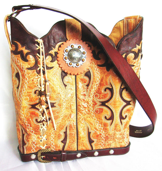 Decorative handbag with intricate patterns and a prominent concho on a white background