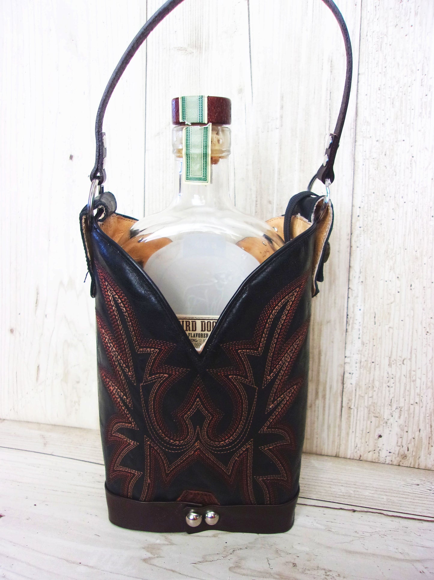 Cowboy Boot Whiskey Tote CR204 handcrafted from cowboy boots. Shop Barware at ChrisThompsonBags.com and buy the best country bridesmaid, country wedding gift, cowboy gift, cowgirl gift, cowgirl party bag, crown royal tote, groomsman gift, rodeo party, rustic liquor tote, western gift, western wedding gift, whiskey caddy, whiskey lover gift at Chris Thompson Bags.