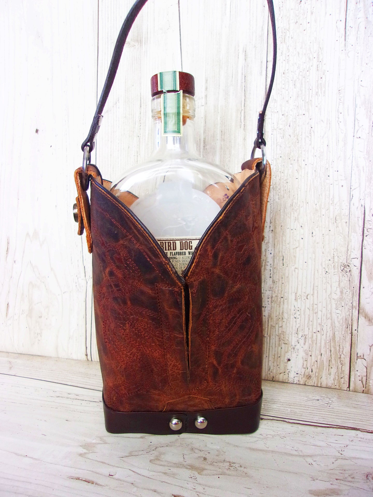 Cowboy Boot Whiskey Tote CR207 handcrafted from cowboy boots. Shop Barware at ChrisThompsonBags.com and buy the best country bridesmaid, country wedding gift, cowboy gift, cowgirl gift, cowgirl party bag, crown royal tote, groomsman gift, rodeo party, rustic liquor tote, western gift, western wedding gift, whiskey caddy, whiskey lover gift at Chris Thompson Bags.