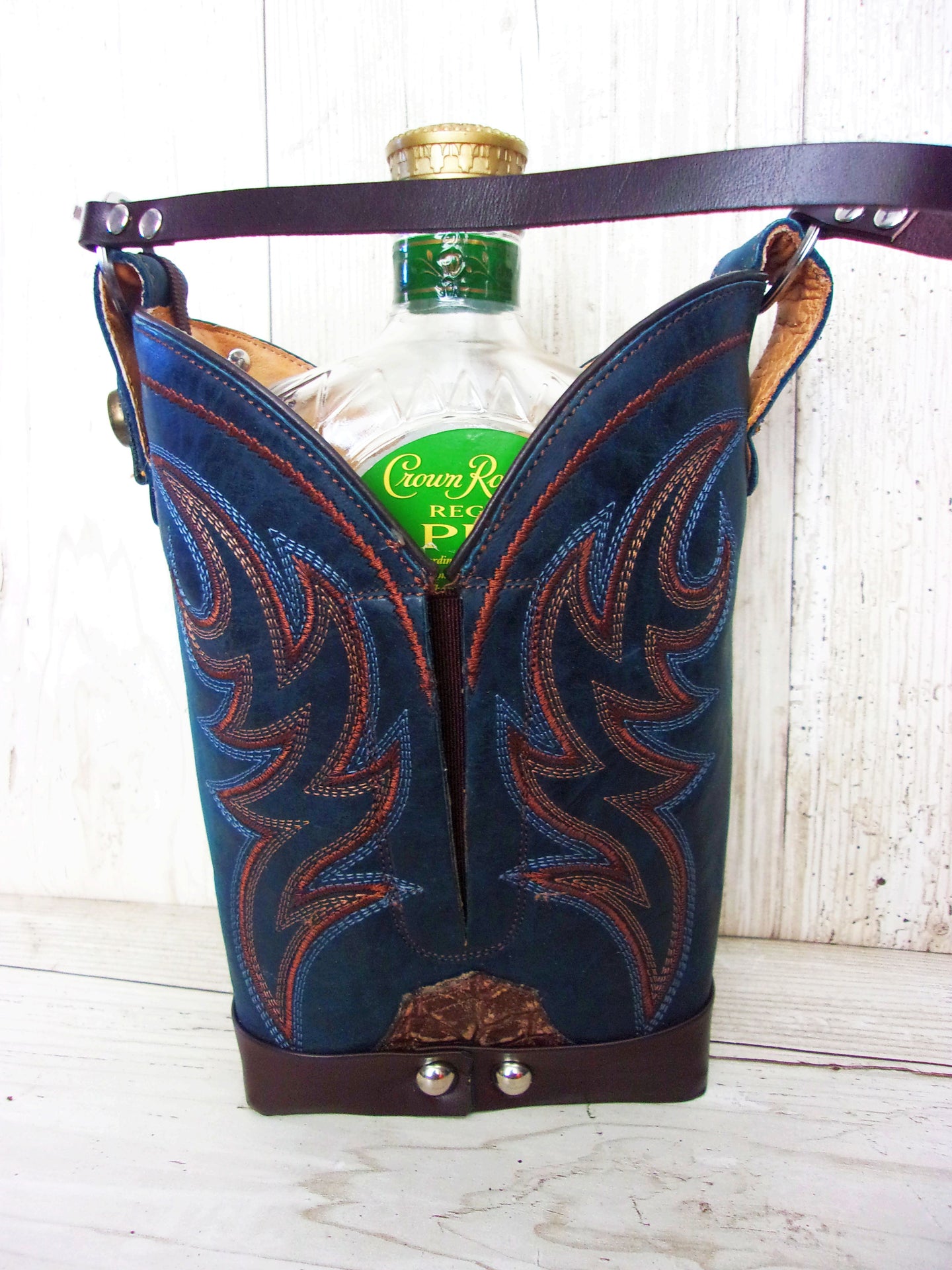 Cowboy Boot Whiskey Tote CR215 handcrafted from cowboy boots. Shop Barware at ChrisThompsonBags.com and buy the best country bridesmaid, country wedding gift, cowboy gift, cowgirl gift, cowgirl party bag, crown royal tote, groomsman gift, rodeo party, rustic liquor tote, western gift, western wedding gift, whiskey caddy, whiskey lover gift at Chris Thompson Bags.