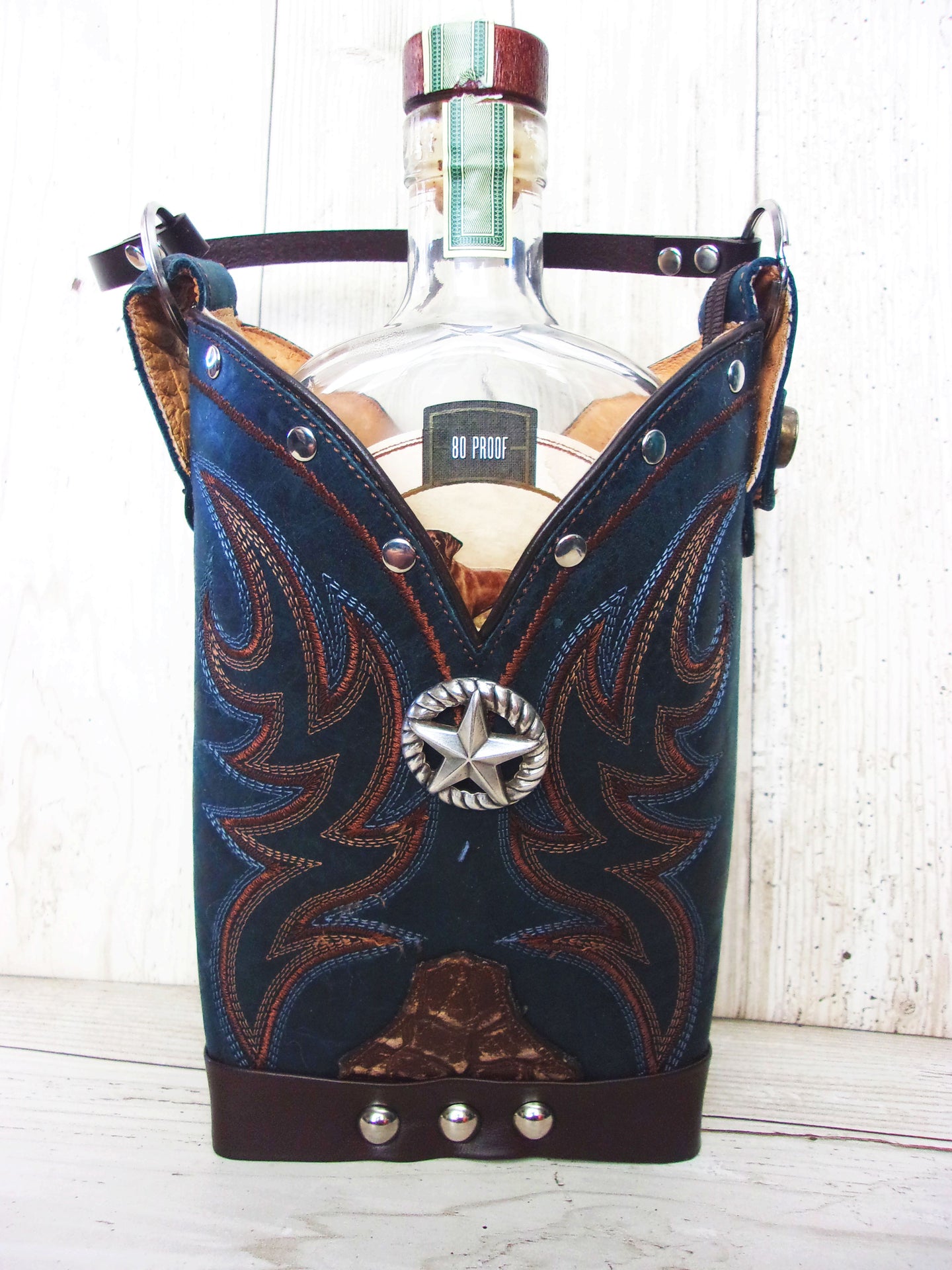 Cowboy Boot Whiskey Tote CR215 handcrafted from cowboy boots. Shop Barware at ChrisThompsonBags.com and buy the best country bridesmaid, country wedding gift, cowboy gift, cowgirl gift, cowgirl party bag, crown royal tote, groomsman gift, rodeo party, rustic liquor tote, western gift, western wedding gift, whiskey caddy, whiskey lover gift at Chris Thompson Bags.