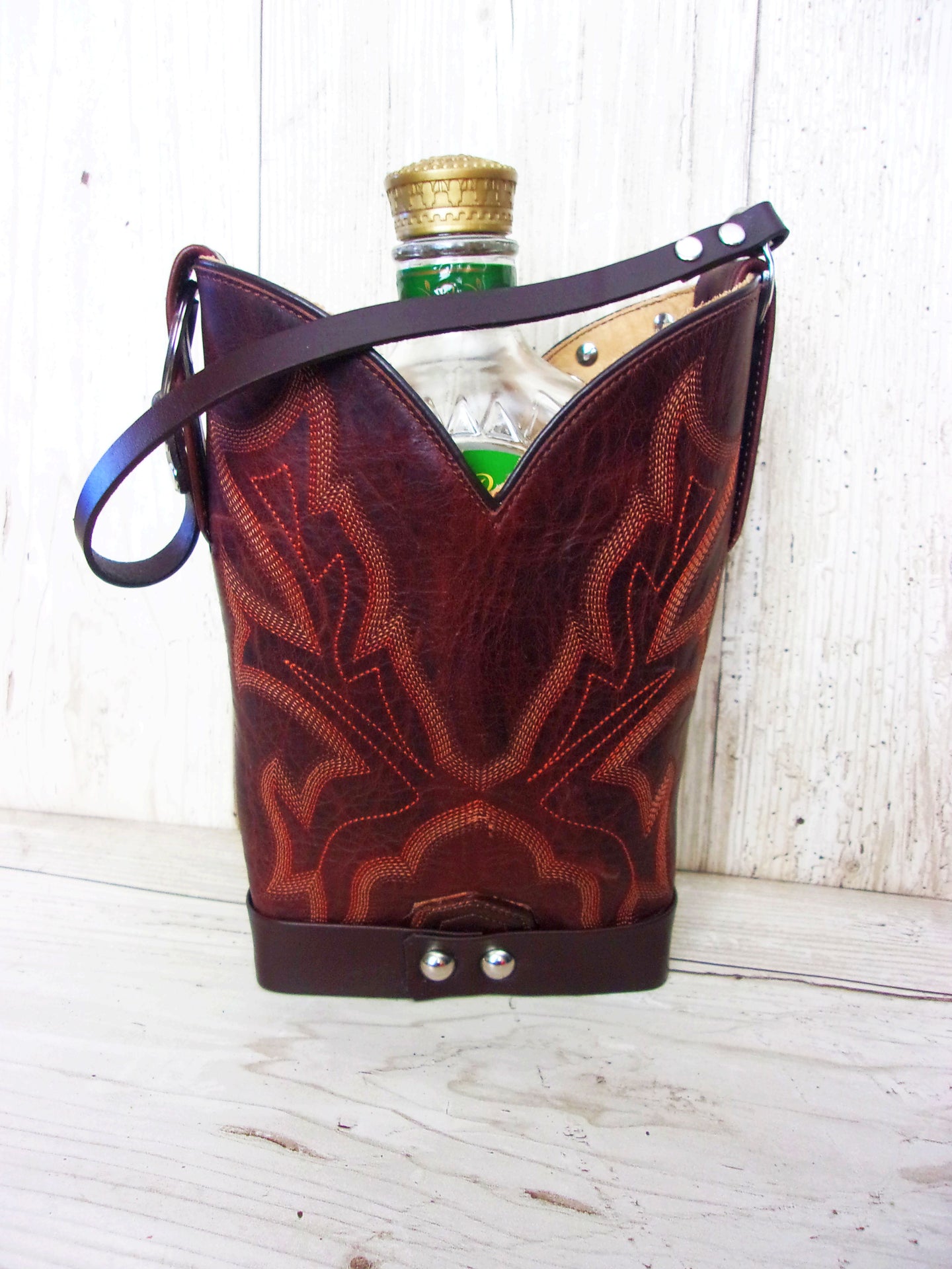 Cowboy Boot Whiskey Tote CR216 handcrafted from cowboy boots. Shop Barware at ChrisThompsonBags.com and buy the best country bridesmaid, country wedding gift, cowboy gift, cowgirl gift, cowgirl party bag, crown royal tote, groomsman gift, rodeo party, rustic liquor tote, western gift, western wedding gift, whiskey caddy, whiskey lover gift at Chris Thompson Bags.