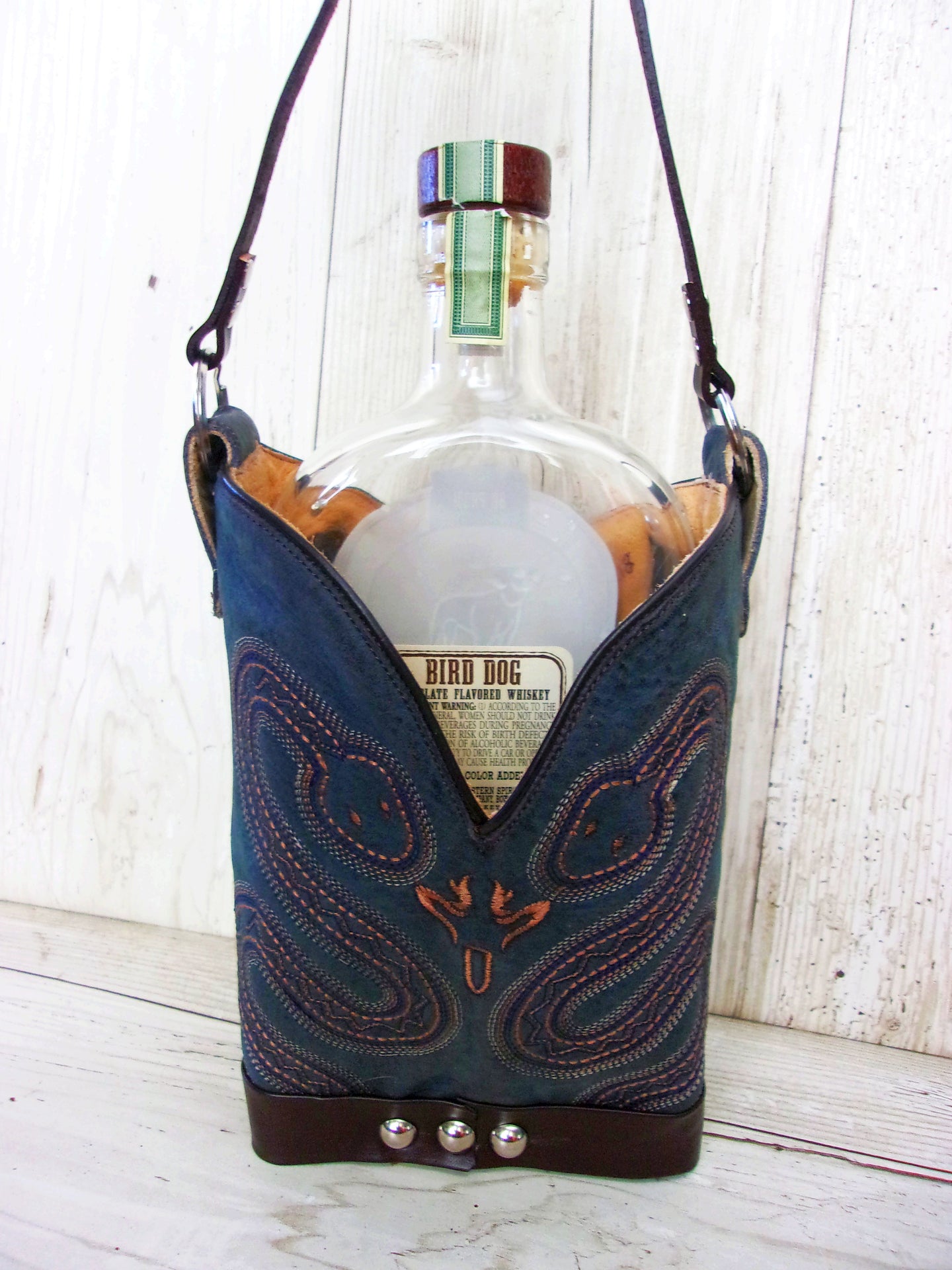 Cowboy Boot Whiskey Tote CR218 handcrafted from cowboy boots. Shop Barware at ChrisThompsonBags.com and buy the best country bridesmaid, country wedding gift, cowboy gift, cowgirl gift, cowgirl party bag, crown royal tote, groomsman gift, rodeo party, rustic liquor tote, western gift, western wedding gift, whiskey caddy, whiskey lover gift at Chris Thompson Bags.