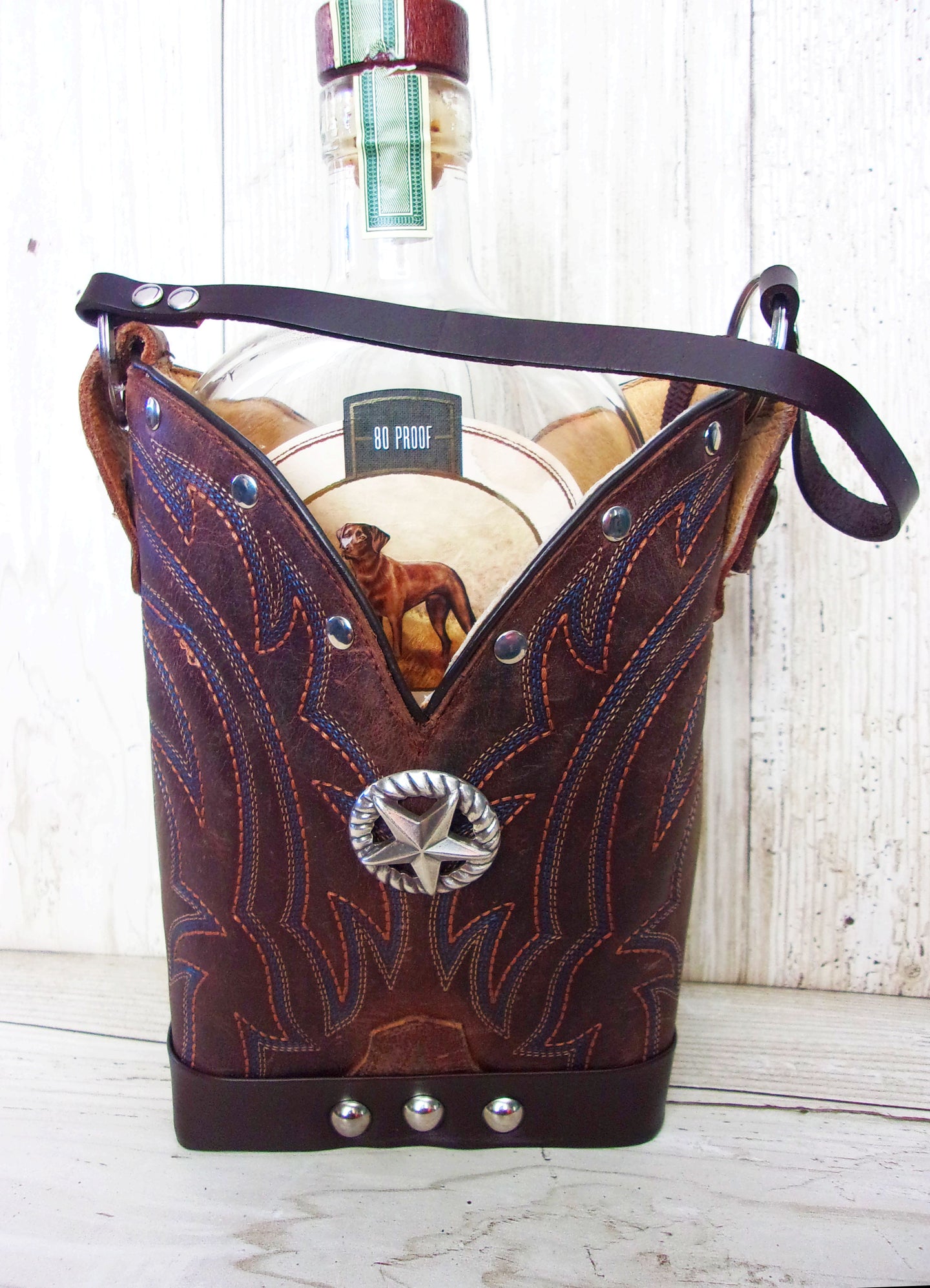 Cowboy Boot Whiskey Tote CR219 handcrafted from cowboy boots. Shop Barware at ChrisThompsonBags.com and buy the best country bridesmaid, country wedding gift, cowboy gift, cowgirl gift, cowgirl party bag, crown royal tote, groomsman gift, rodeo party, rustic liquor tote, western gift, western wedding gift, whiskey caddy, whiskey lover gift at Chris Thompson Bags.