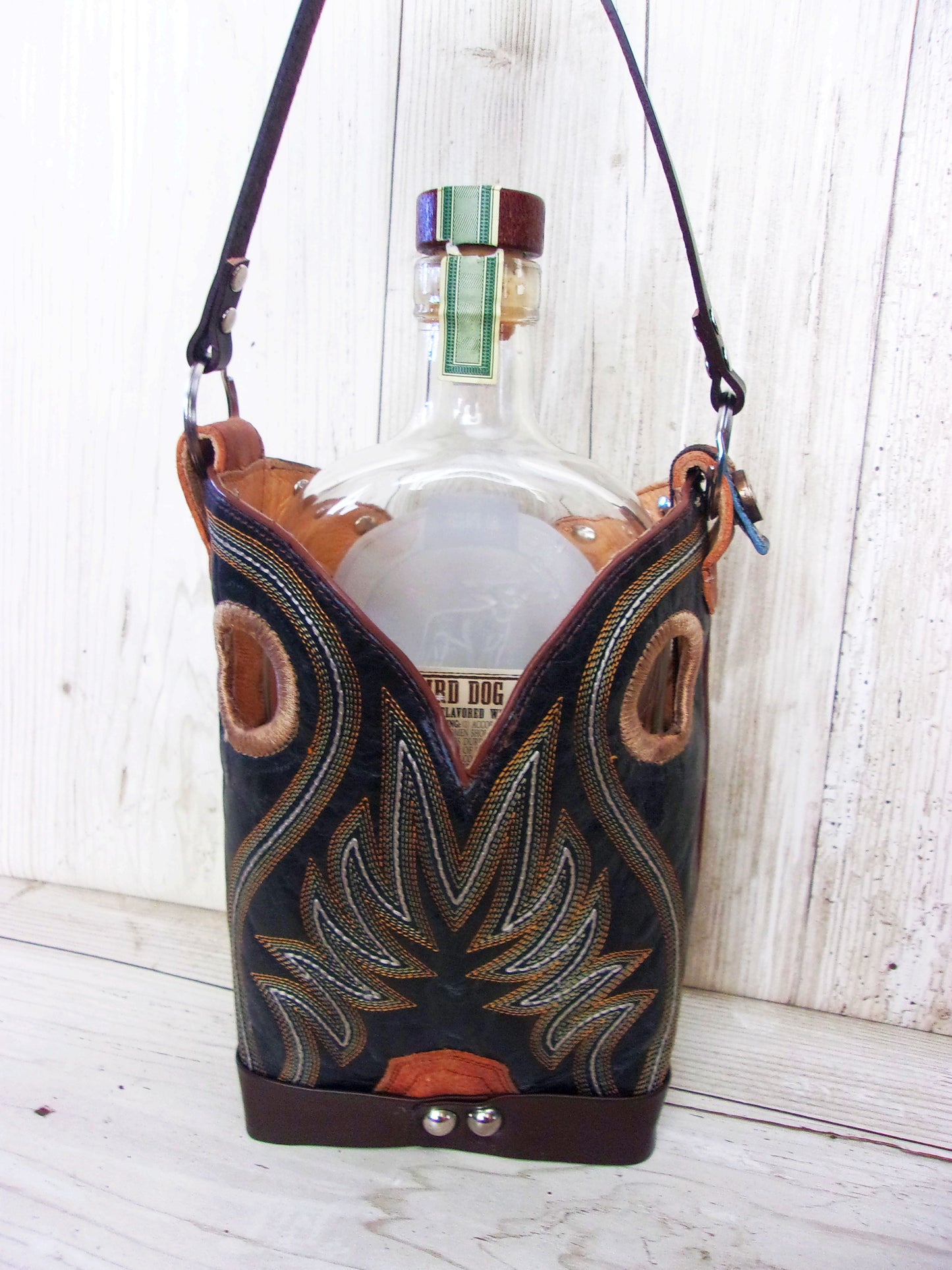 Cowboy Boot Whiskey Tote CR220 handcrafted from cowboy boots. Shop Barware at ChrisThompsonBags.com and buy the best country bridesmaid, country wedding gift, cowboy gift, cowgirl gift, cowgirl party bag, crown royal tote, groomsman gift, rodeo party, rustic liquor tote, western gift, western wedding gift, whiskey caddy, whiskey lover gift at Chris Thompson Bags.