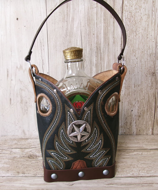 Decorative leather bottle holder with a bottle inside on a wooden surface