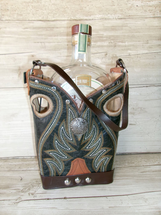 Decorative leather bottle holder with a bottle inside on a wooden surface