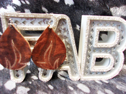 Leather Earrings ER25 handcrafted from cowboy boots. Shop jewelry at and buy the best cowboy boot scraps, cowgirl earrings, eco friendly fashion, hippie earrings, leather earrings, leather jewelry, recycled fashion, sustainable jewelry, unique earrings at Chris Thompson Bags.