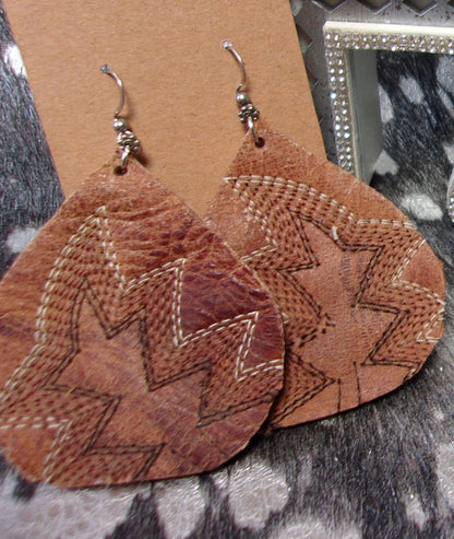 Leather Earrings ER31 handcrafted from cowboy boots. Shop jewelry at and buy the best cowboy boot scraps, cowgirl earrings, eco friendly fashion, hippie earrings, leather earrings, leather jewelry, recycled fashion, sustainable jewelry, unique earrings at Chris Thompson Bags.