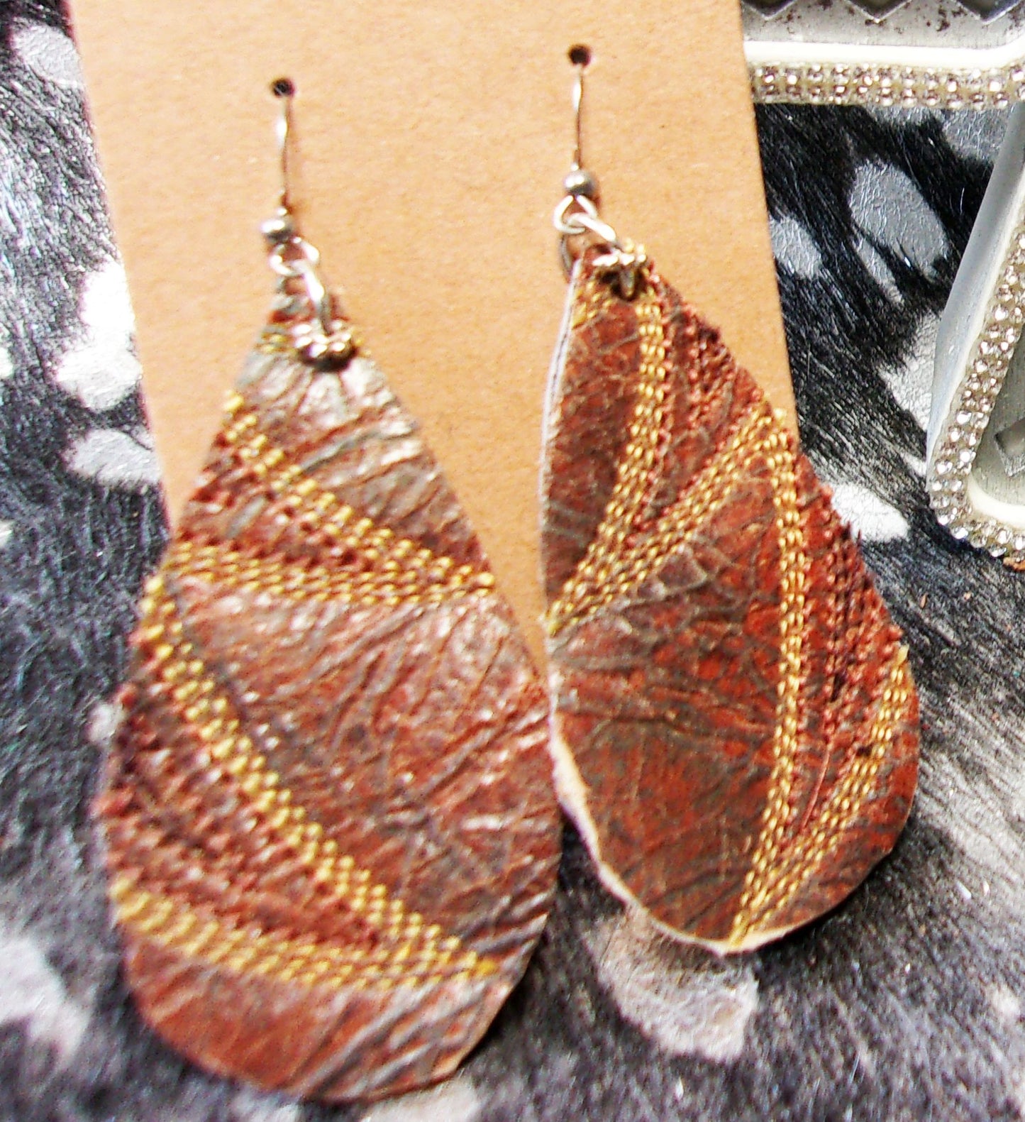 Leather Earrings ER34 handcrafted from cowboy boots. Shop jewelry at and buy the best cowboy boot scraps, cowgirl earrings, eco friendly fashion, hippie earrings, leather earrings, leather jewelry, recycled fashion, sustainable jewelry, unique earrings at Chris Thompson Bags.