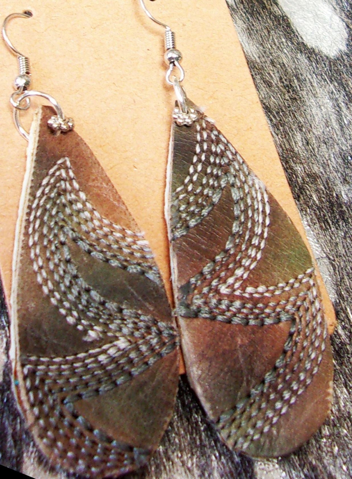 Leather Earrings ER40 handcrafted from cowboy boots. Shop jewelry at and buy the best cowboy boot scraps, cowgirl earrings, eco friendly fashion, hippie earrings, leather earrings, leather jewelry, recycled fashion, sustainable jewelry, unique earrings at Chris Thompson Bags.