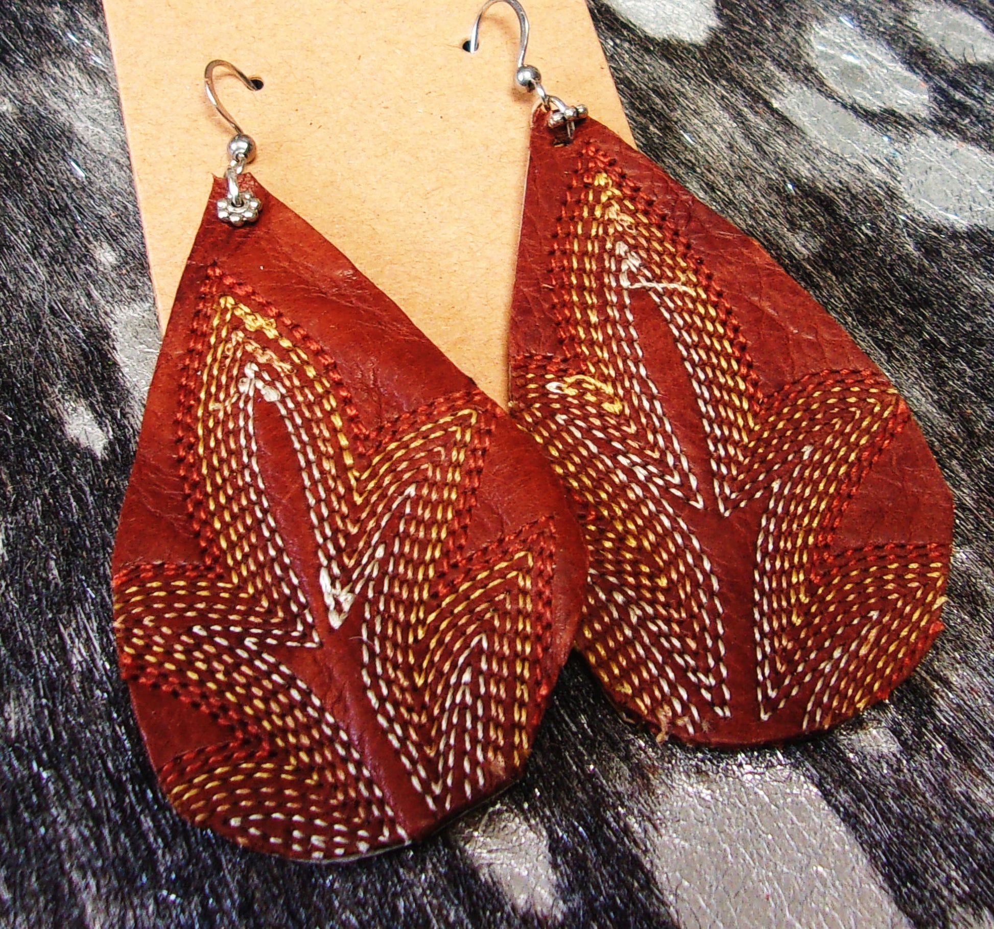 Leather Earrings ER48 handcrafted from cowboy boots. Shop jewelry at and buy the best cowboy boot scraps, cowgirl earrings, eco friendly fashion, hippie earrings, leather earrings, leather jewelry, recycled fashion, sustainable jewelry, unique earrings at Chris Thompson Bags.