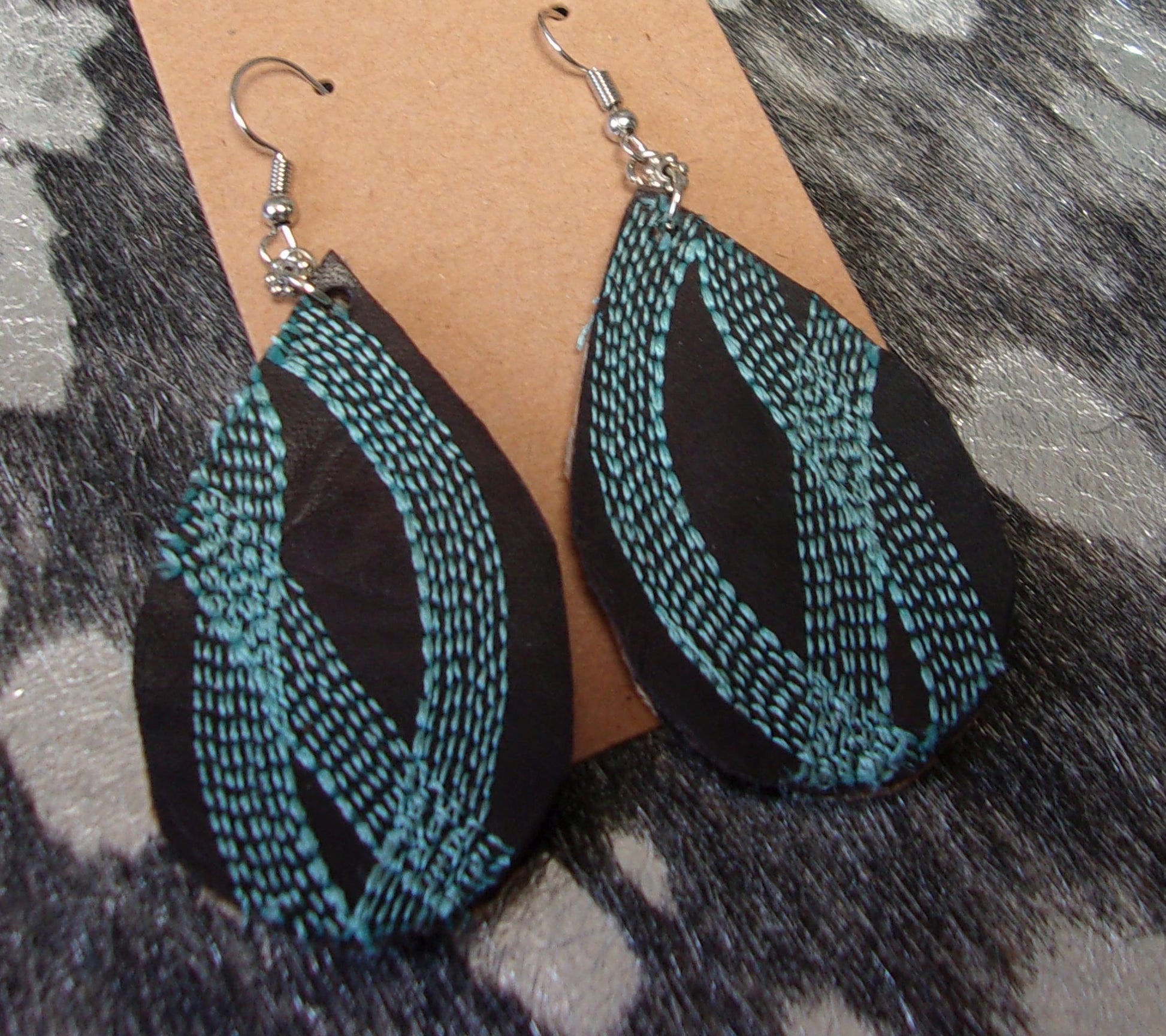 Leather Earrings ER50 handcrafted from cowboy boots. Shop jewelry at and buy the best cowboy boot scraps, cowgirl earrings, eco friendly fashion, hippie earrings, leather earrings, leather jewelry, recycled fashion, sustainable jewelry, unique earrings at Chris Thompson Bags.