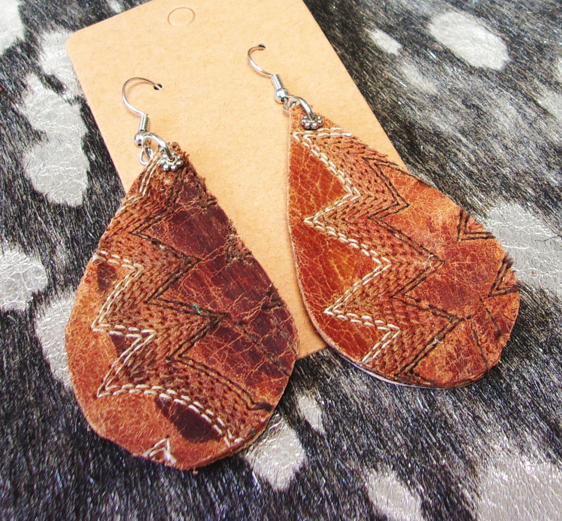 Leather Earrings ER53 handcrafted from cowboy boots. Shop jewelry at and buy the best cowboy boot scraps, cowgirl earrings, eco friendly fashion, hippie earrings, leather earrings, leather jewelry, recycled fashion, sustainable jewelry, unique earrings at Chris Thompson Bags.