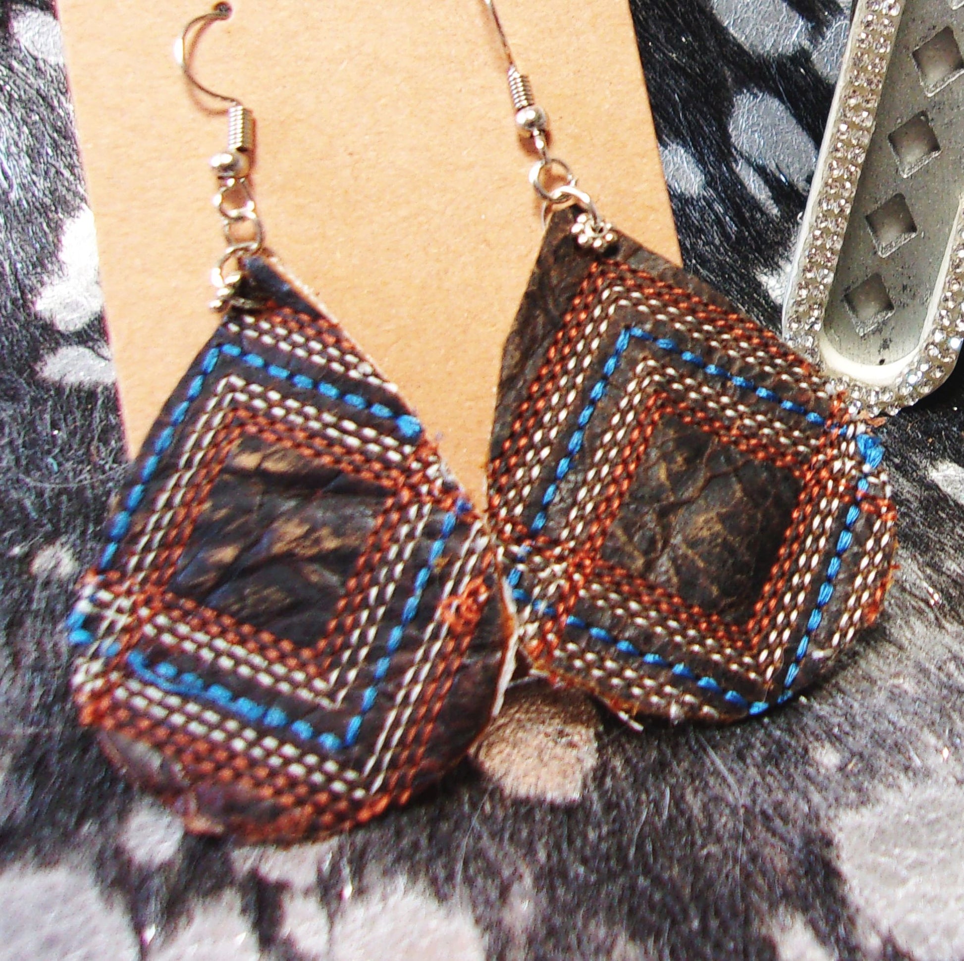 Leather Earrings ER54 handcrafted from cowboy boots. Shop jewelry at and buy the best cowboy boot scraps, cowgirl earrings, eco friendly fashion, hippie earrings, leather earrings, leather jewelry, recycled fashion, sustainable jewelry, unique earrings at Chris Thompson Bags.