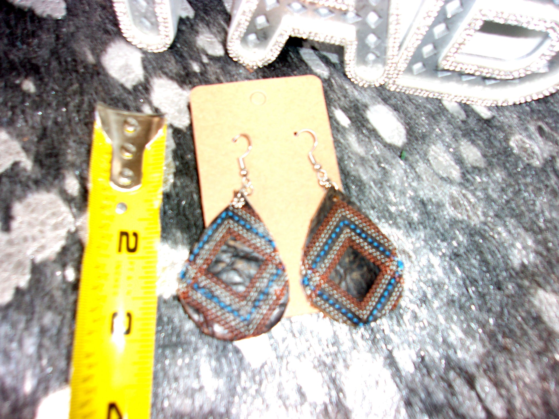 Leather Earrings ER54 handcrafted from cowboy boots. Shop jewelry at and buy the best cowboy boot scraps, cowgirl earrings, eco friendly fashion, hippie earrings, leather earrings, leather jewelry, recycled fashion, sustainable jewelry, unique earrings at Chris Thompson Bags.