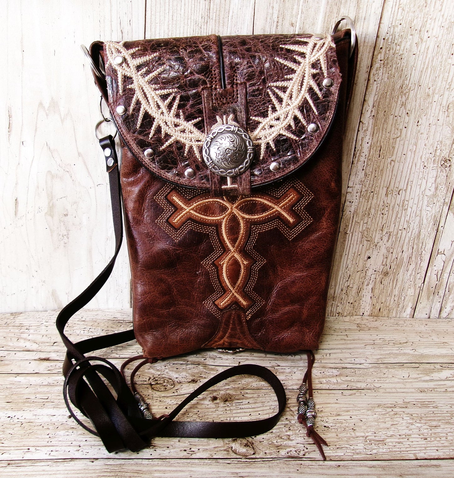 leather bag with cross embroidery