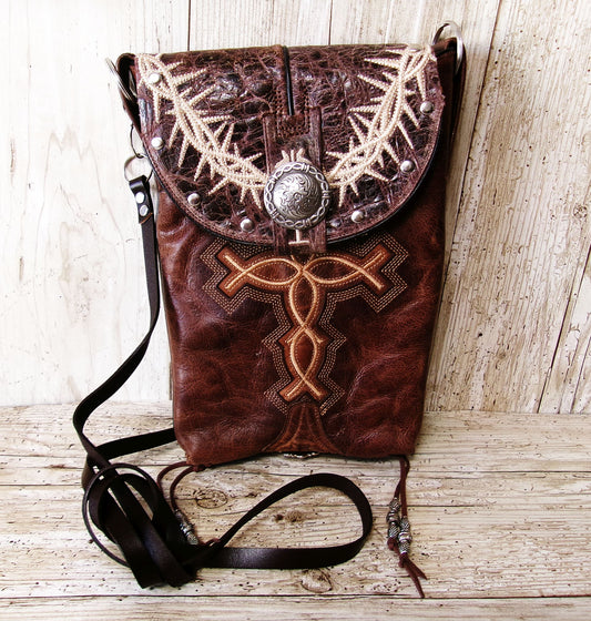 leather bag with cross embroidery