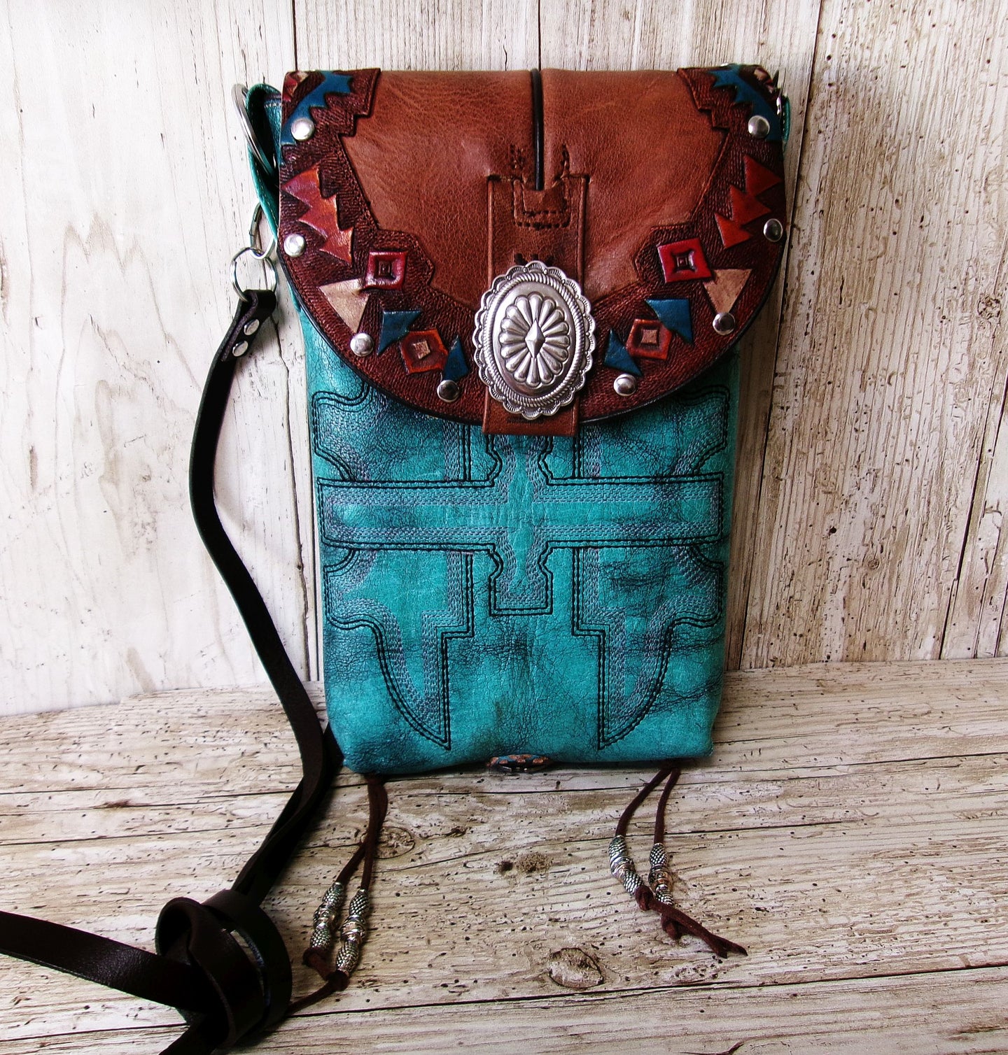 turquoise leather bag with southwest design