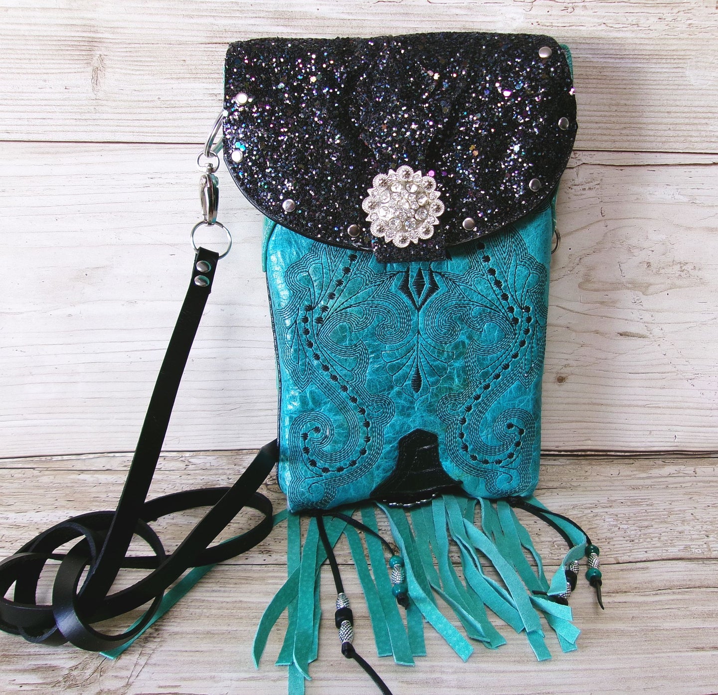 turquoise and black crossbody bag