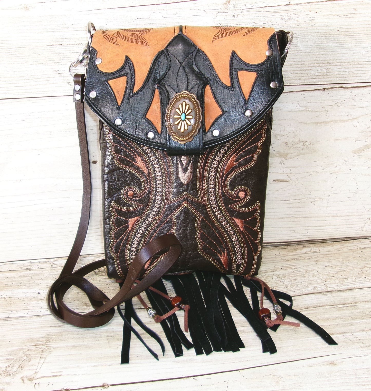 brown crossbody bag with strap and fringe
