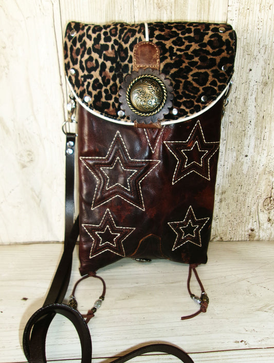 Leopard print bag with star designs on a wooden surface
