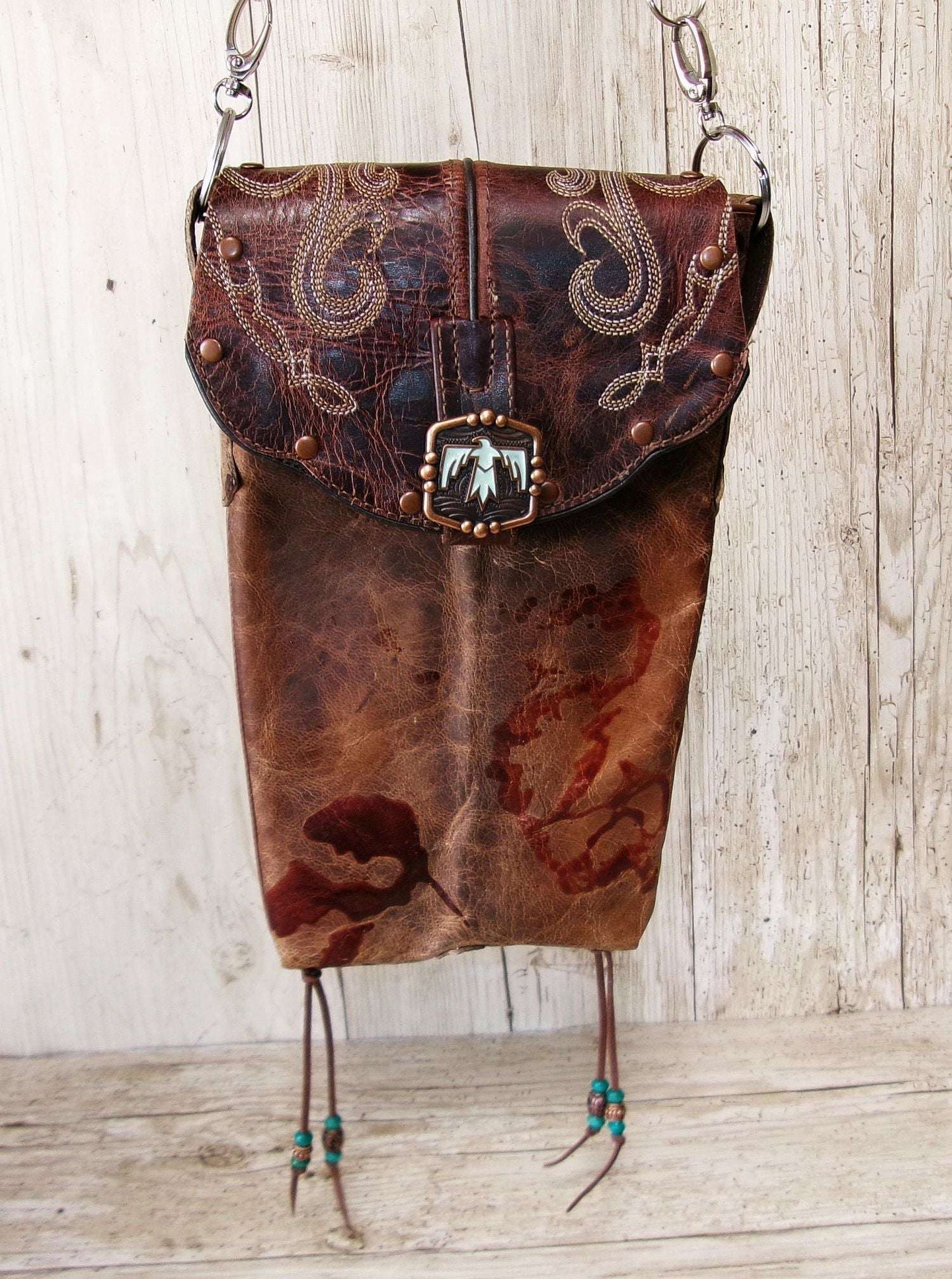 Cowboy Boot Crossbody Hipster Bag HP1120 handcrafted from cowboy boots. Shop Handbags at ChrisThompsonBags.com and buy the best ["Crossbody","fringe","Hipster","phoenix","Small","thunderbird","Turquoise"] at Chris Thompson Bags.