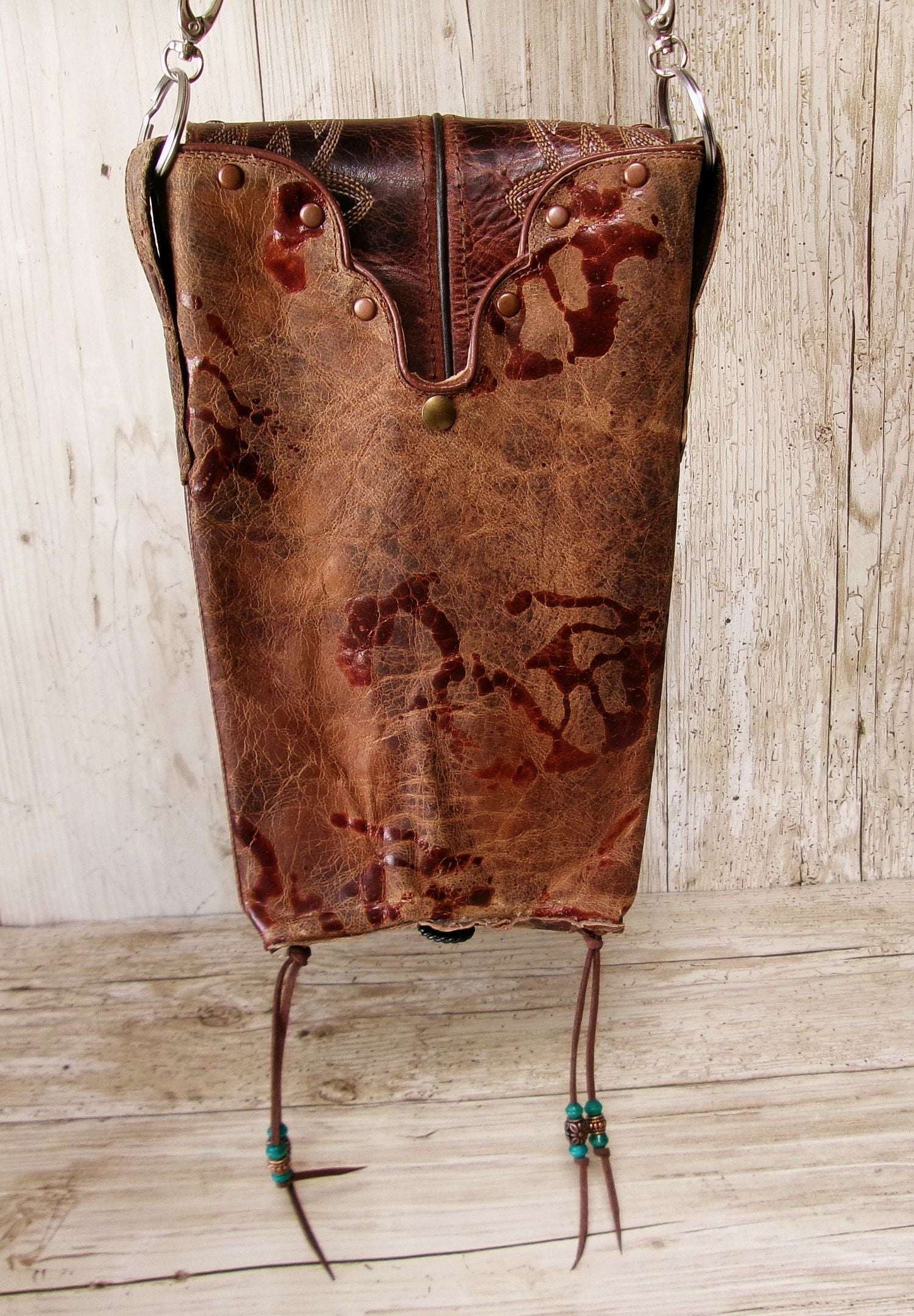 Cowboy Boot Crossbody Hipster Bag HP1120 handcrafted from cowboy boots. Shop Handbags at ChrisThompsonBags.com and buy the best ["Crossbody","fringe","Hipster","phoenix","Small","thunderbird","Turquoise"] at Chris Thompson Bags.