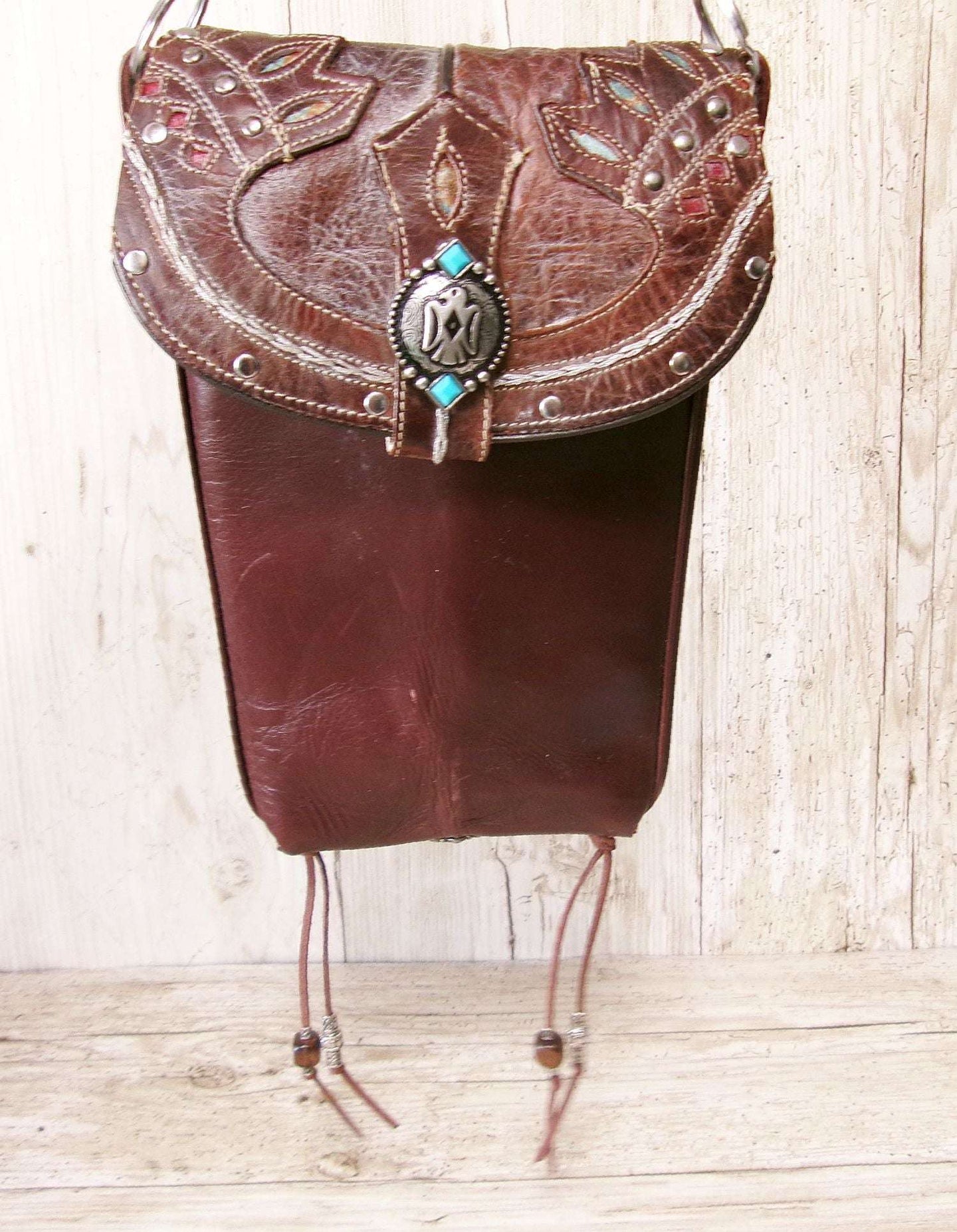 Cowboy Boot Crossbody Hipster Bag HP1123 handcrafted from cowboy boots. Shop Handbags at ChrisThompsonBags.com and buy the best ["Crossbody","fringe","Hipster","phoenix","Small","thunderbird","Turquoise"] at Chris Thompson Bags.