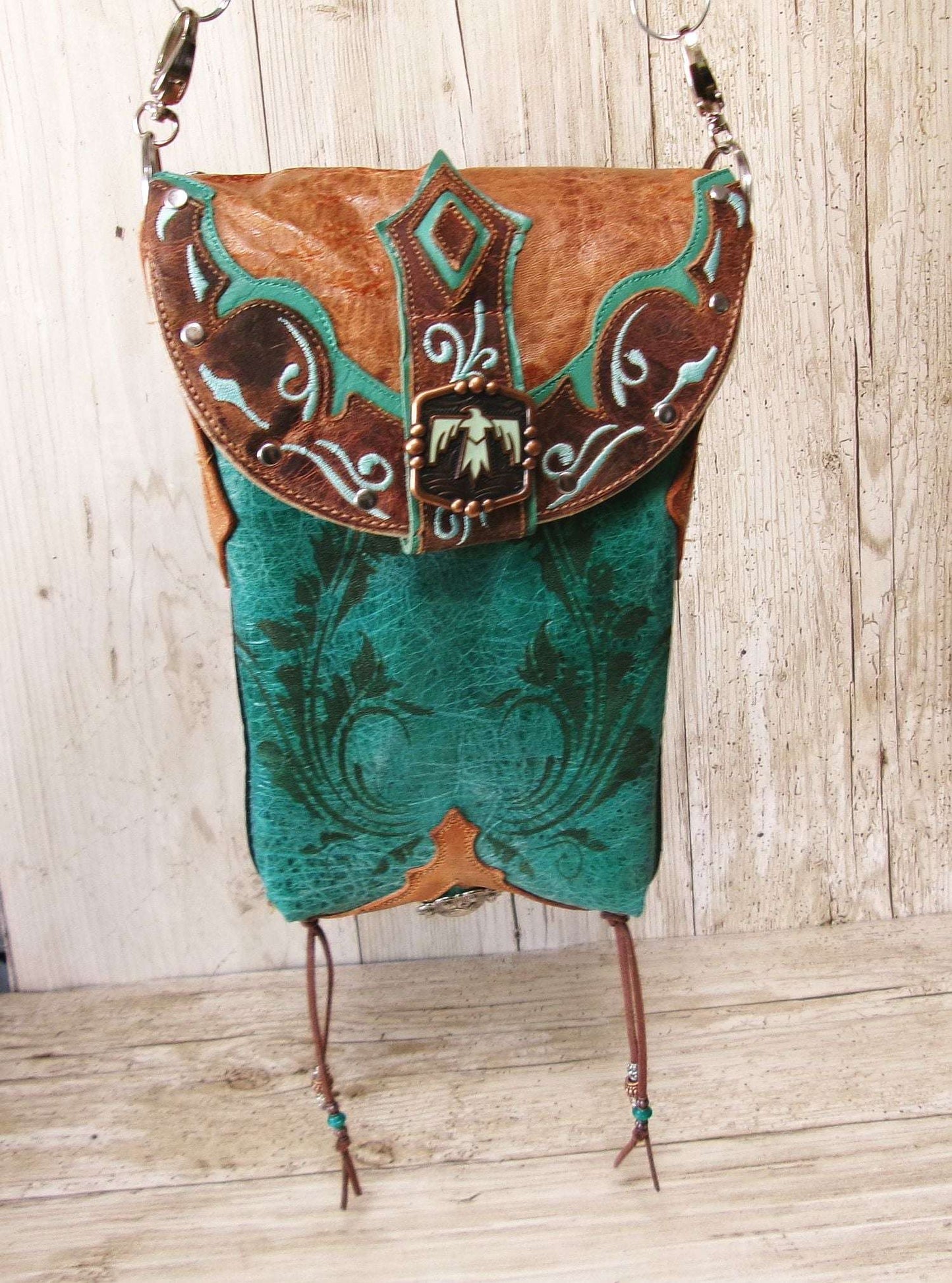 Cowboy Boot Crossbody Hipster Bag HP1126 handcrafted from cowboy boots. Shop Handbags at ChrisThompsonBags.com and buy the best ["Crossbody","fringe","Hipster","phoenix","Small","thunderbird","Turquoise"] at Chris Thompson Bags.