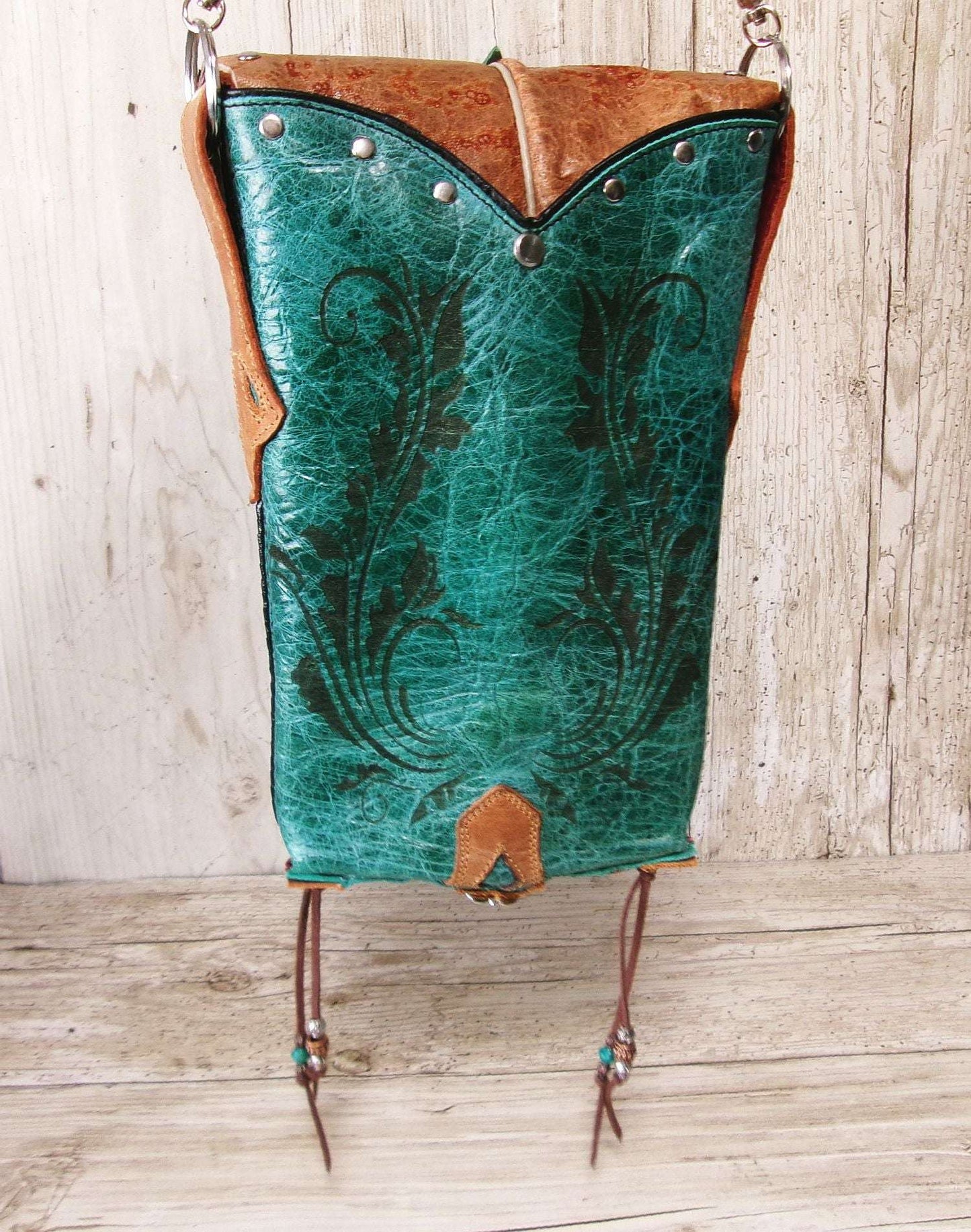 Cowboy Boot Crossbody Hipster Bag HP1126 handcrafted from cowboy boots. Shop Handbags at ChrisThompsonBags.com and buy the best ["Crossbody","fringe","Hipster","phoenix","Small","thunderbird","Turquoise"] at Chris Thompson Bags.