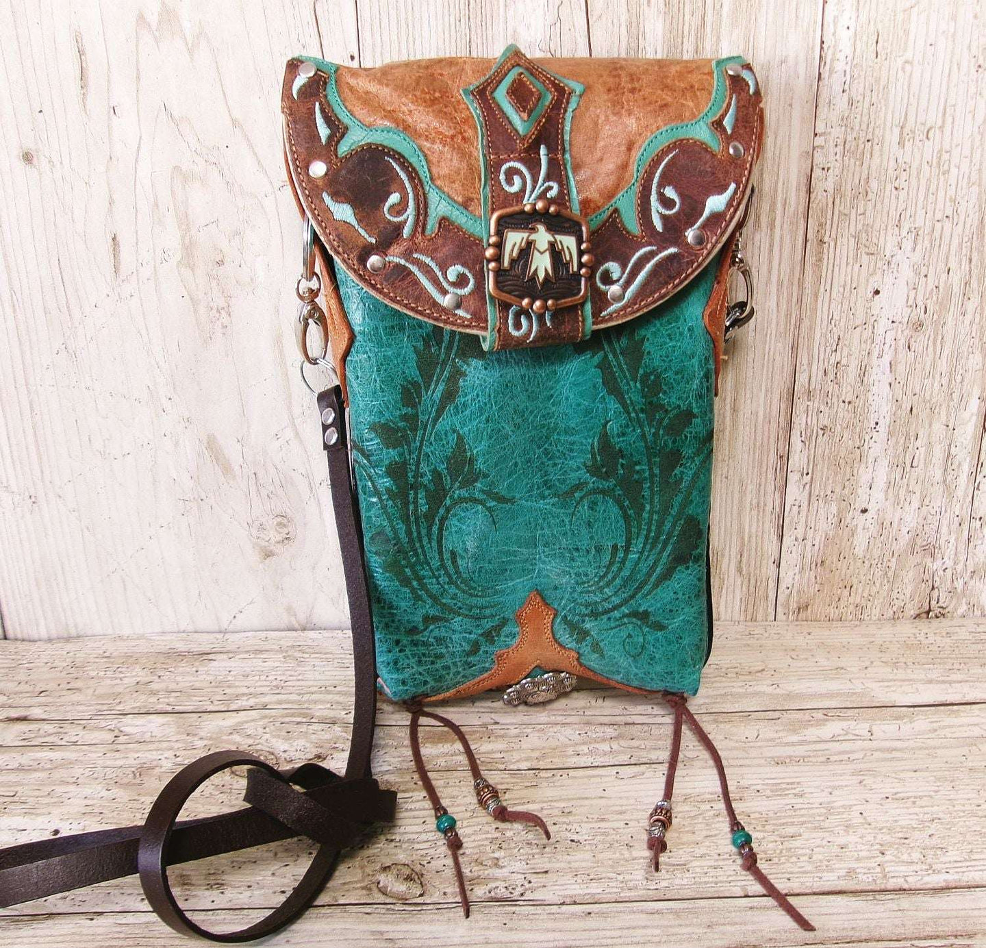Cowboy Boot Crossbody Hipster Bag HP1126 handcrafted from cowboy boots. Shop Handbags at ChrisThompsonBags.com and buy the best ["Crossbody","fringe","Hipster","phoenix","Small","thunderbird","Turquoise"] at Chris Thompson Bags.
