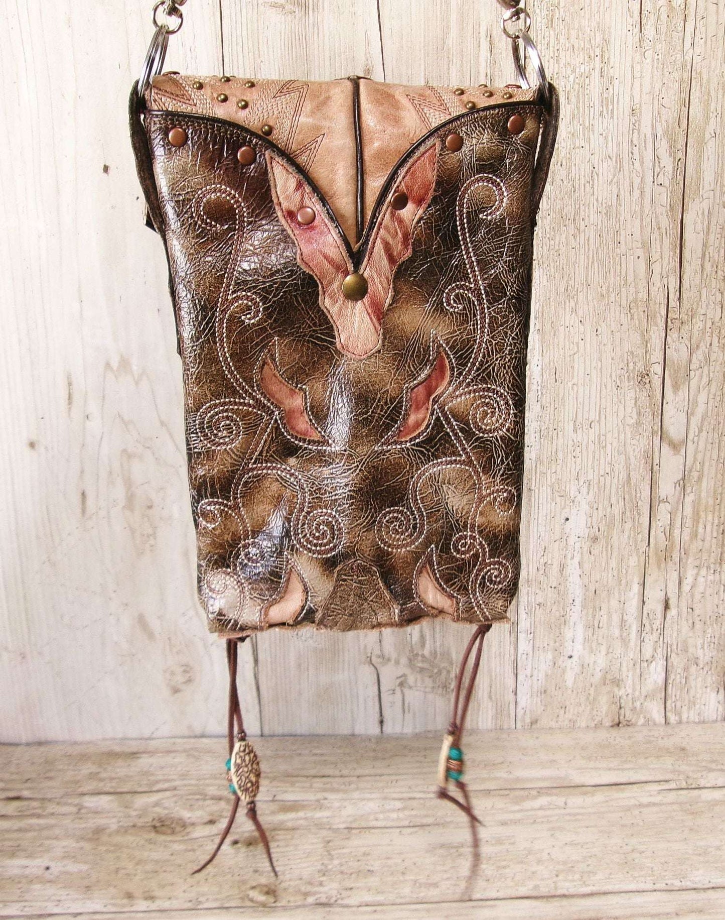 Cowboy Boot Crossbody Hipster Bag HP1128 handcrafted from cowboy boots. Shop Handbags at ChrisThompsonBags.com and buy the best ["Crossbody","fringe","Hipster","phoenix","Small","thunderbird"] at Chris Thompson Bags.