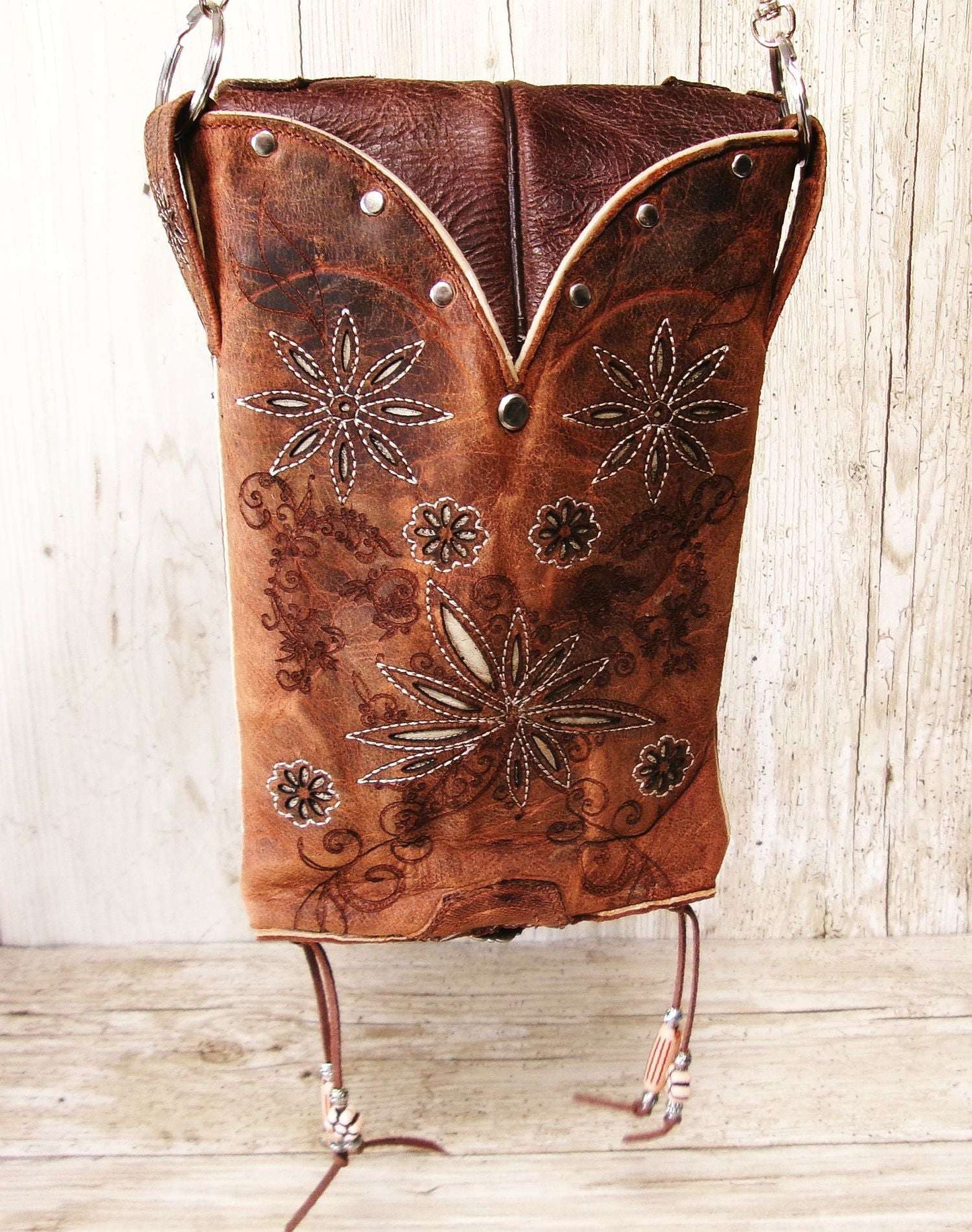 Cowboy Boot Crossbody Hipster Bag HP1131 handcrafted from cowboy boots. Shop Handbags at ChrisThompsonBags.com and buy the best ["Crossbody","feathers","floral","fringe","Hipster","Small"] at Chris Thompson Bags.