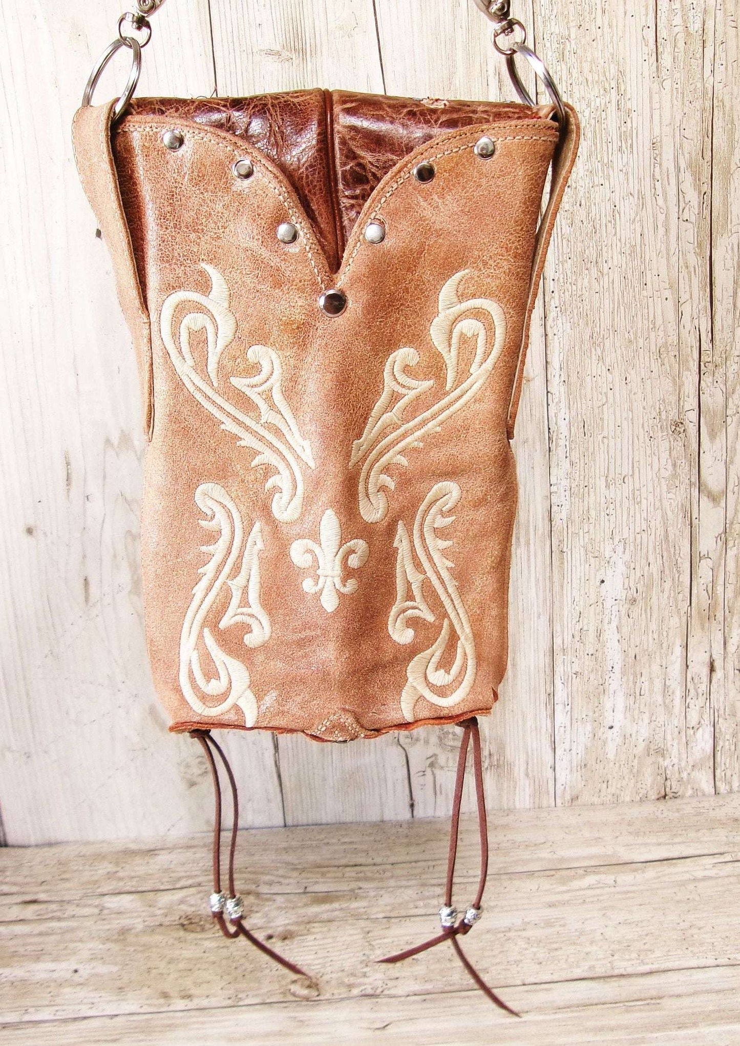 Cowboy Boot Crossbody Hipster Bag HP1132 handcrafted from cowboy boots. Shop Handbags at ChrisThompsonBags.com and buy the best ["Crossbody","floral","fringe","Hipster","Small"] at Chris Thompson Bags.