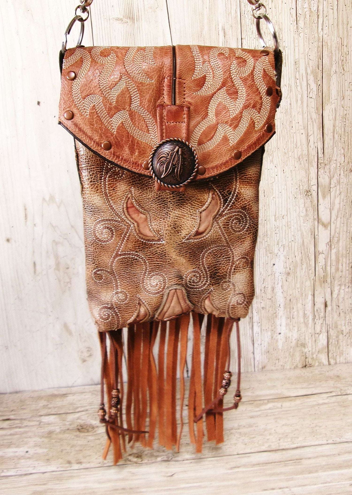 Cowboy Boot Crossbody Hipster Bag with Fringe HP1138 handcrafted from cowboy boots. Shop Handbags at ChrisThompsonBags.com and buy the best ["Crossbody","feathers","fringe","Hipster","horses","Small"] at Chris Thompson Bags.