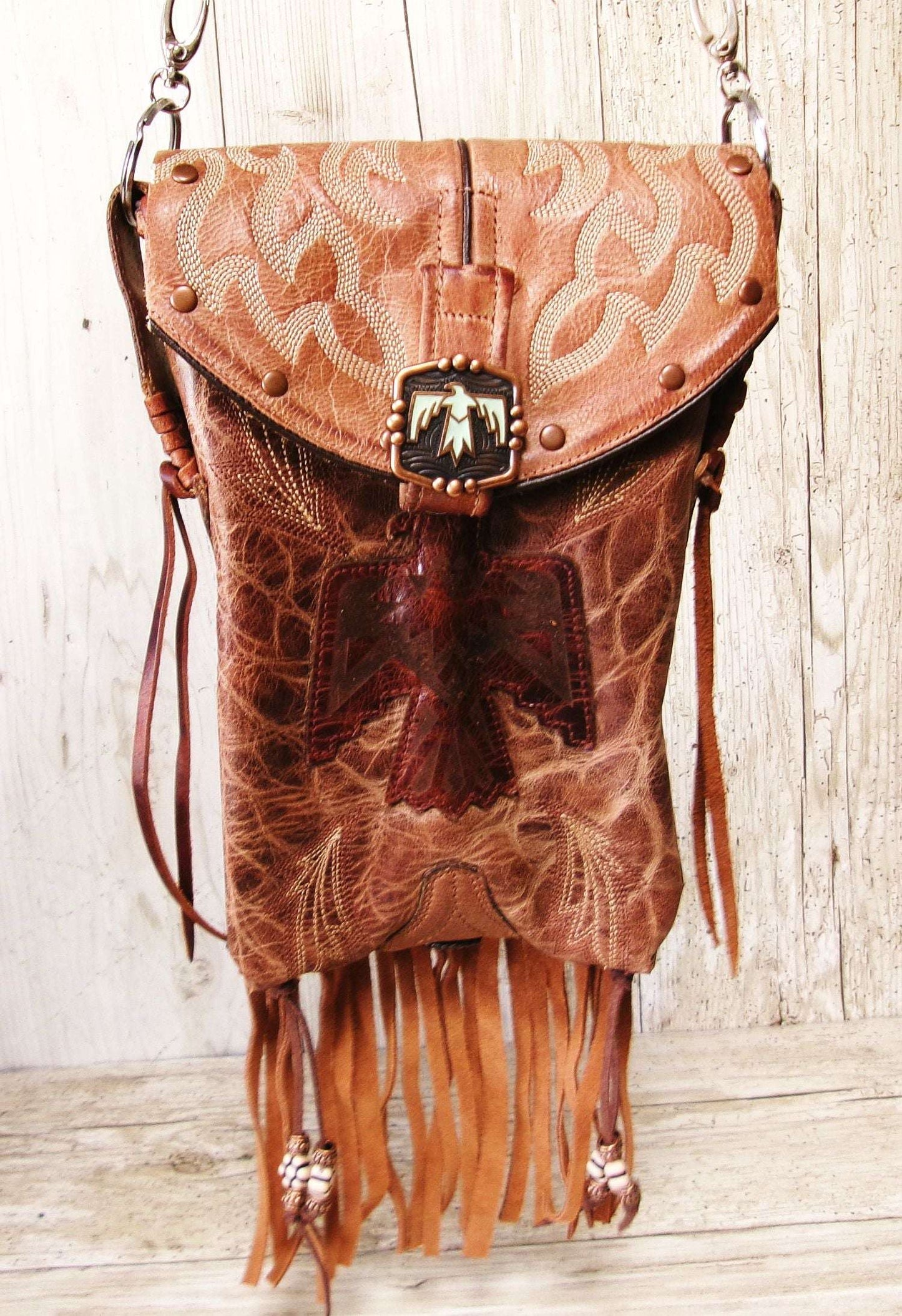 Cowboy Boot Crossbody Hipster Bag with Fringe HP1140 handcrafted from cowboy boots. Shop Handbags at ChrisThompsonBags.com and buy the best ["Crossbody","fringe","Hipster","phoenix","Small","thunderbird"] at Chris Thompson Bags.